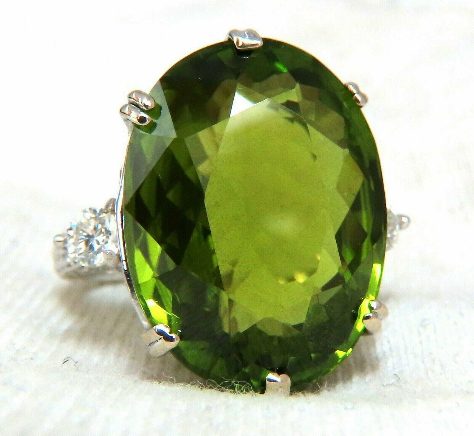 Oval Cut GIA Certified 35.63 Carat Natural Green Peridot Diamonds Rings 18 Karat For Sale