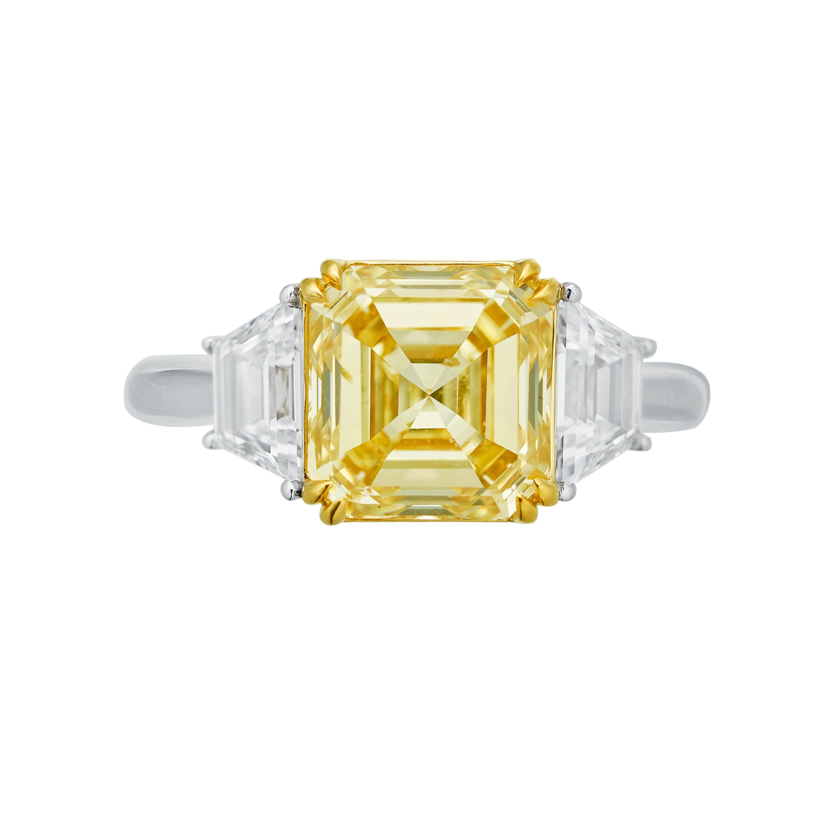 Behold the epitome of love and luxury in this 3.60ct Emerald shape Natural Fancy Yellow diamond ring, an extraordinary symbol of commitment, ideal for weddings and engagements.

At the heart of this masterpiece lies a mesmerizing 3.60ct Emerald