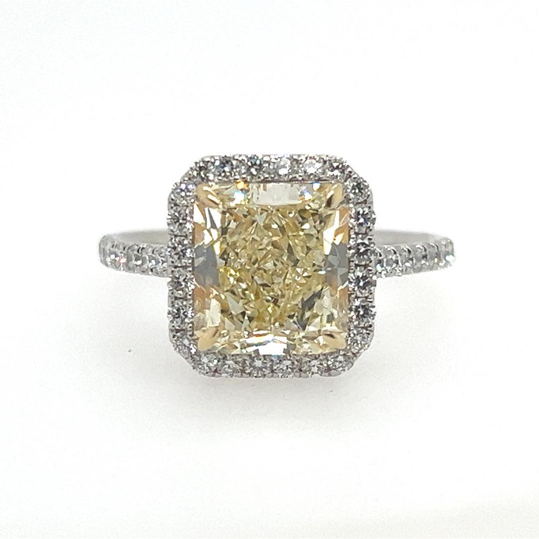 A magnificent Radiant Cut natural 3.61 carat light yellow diamond platinum ring. It is GIA certified (#2155099356) as a natural Y-Z diamond with no fluorescence. Clarity is vs2, measures 8.76x7.88x5.39mm. 

The ring is size 6.75, weighs 5.5 grams.