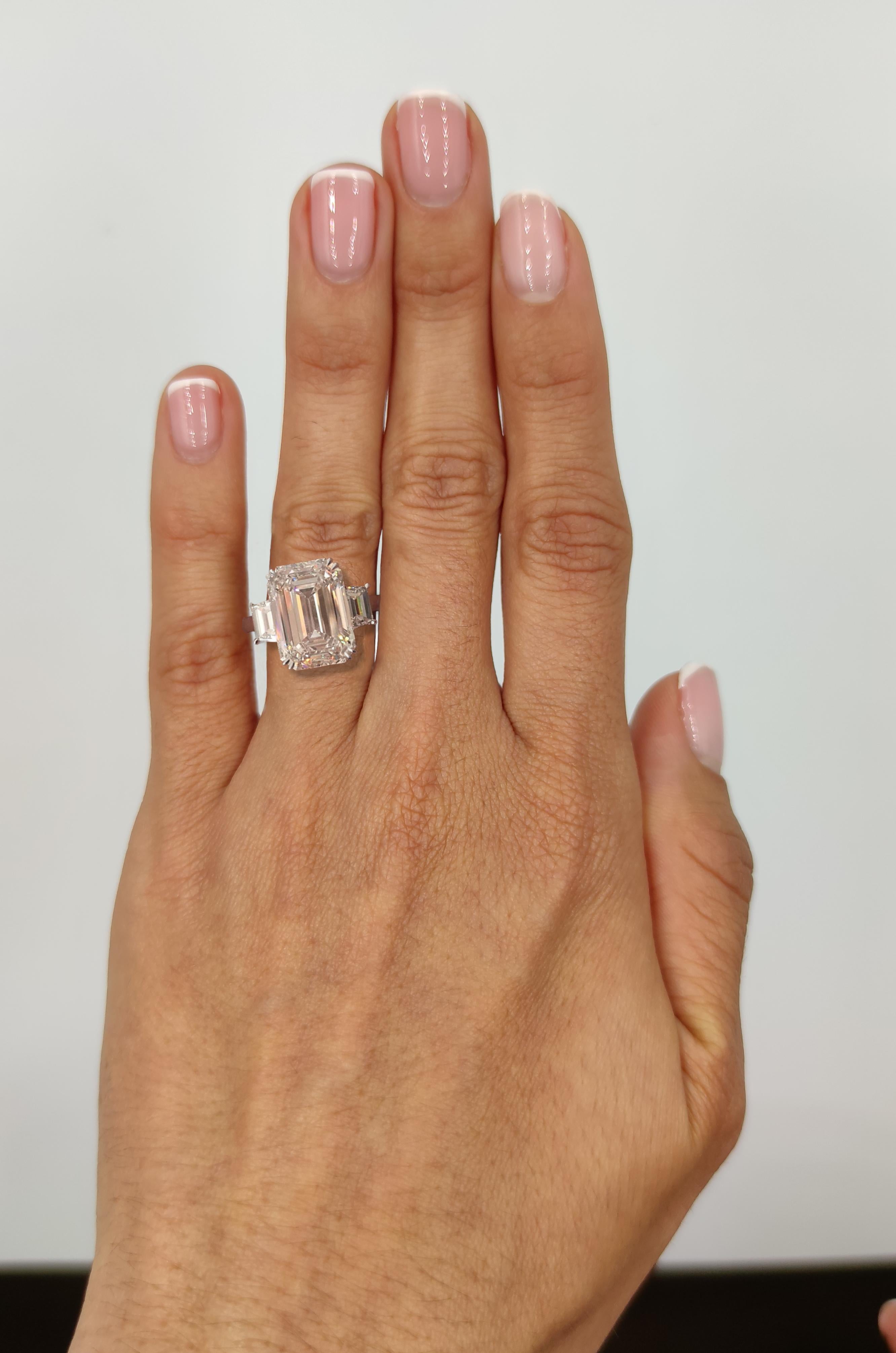 Antinori Fine Jewels is proud to offer this important and impressive  Emerald cut diamond ring. 

The ring consists of one emerald cut diamond weighing 4 carat. The 4 carat center emerald cut is accented by two trapezoid diamonds having a total