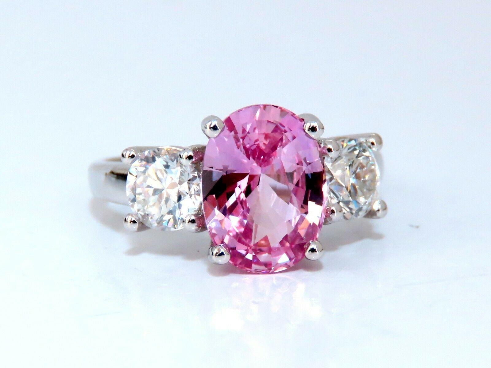 Classic Three Anniversary 

3.66ct. Natural GIA Certified Pink Sapphire Ring

GIA Certified Report ID: 5192270693

10.34 X 7.68 X 5.31mm

Full cut oval brilliant 

Clean Clarity & Transparent

1.02ct. (2) Round Diamonds 

H-color Si-1 clarity.

 