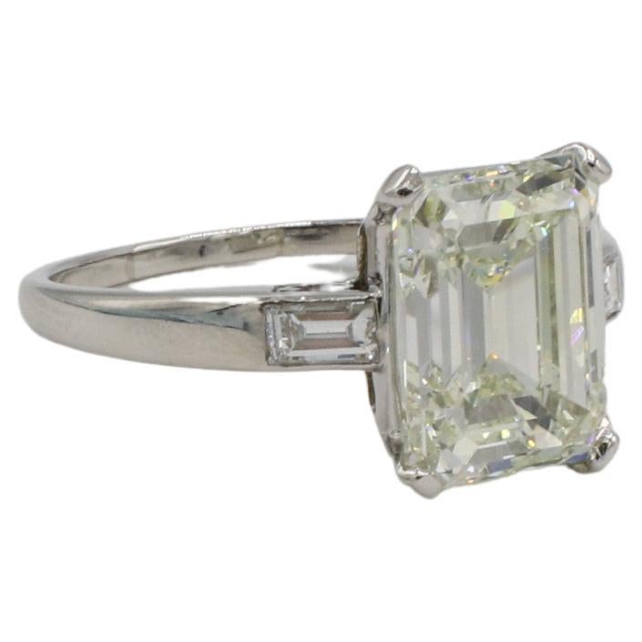 Art Deco GIA Certified 3.67 Carat M VS2 Emerald Cut Natural Diamond Engagement Ring For Sale