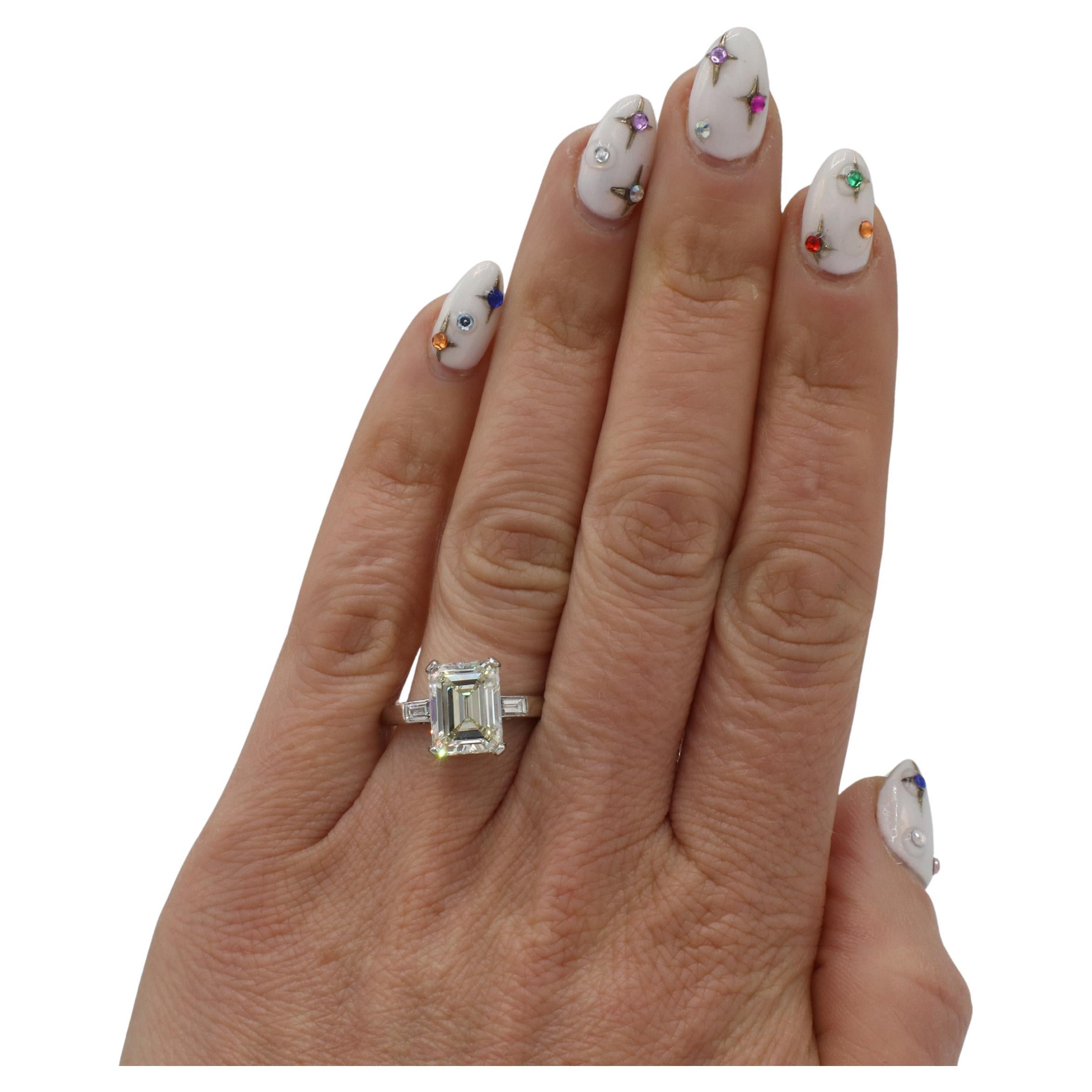 Women's GIA Certified 3.67 Carat M VS2 Emerald Cut Natural Diamond Engagement Ring For Sale