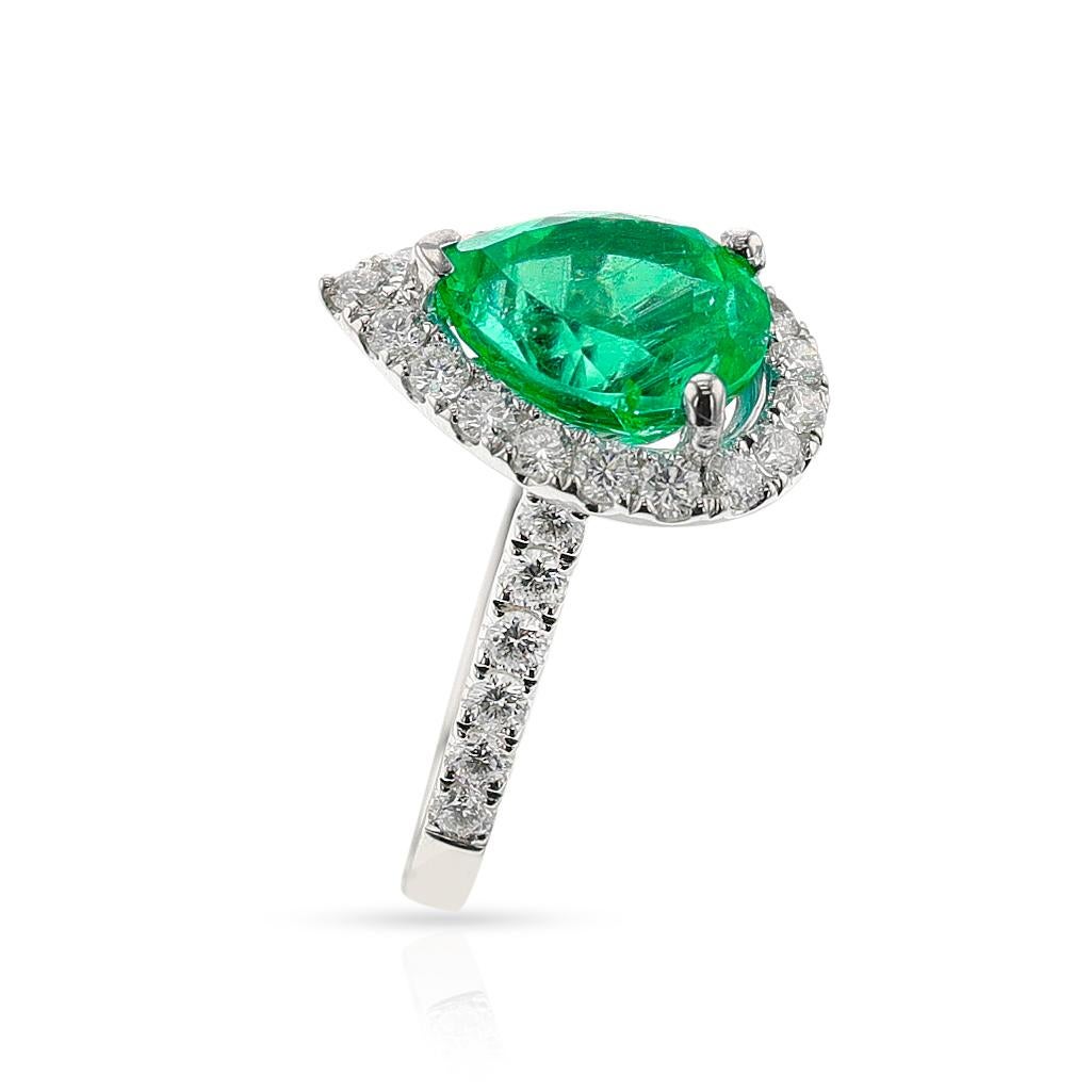 Elevate your look with this stunning GIA-Certified Colombian Emerald and Diamond Ring. Crafted with masterful precision from 18K gold, this sumptuous piece flaunts a breathtaking 3.68 carat pear-shaped emerald and 1.02 carats of diamonds, creating a