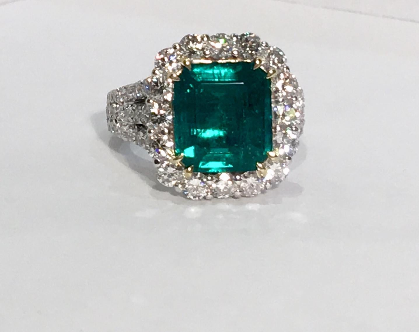 Magnificent, finest quality, 18 karat white gold ring features a GIA certified, F1, octagonal step cut, transparent green Colombian emerald weighing 3.69 carats and measuring 10.94 mm x 9.73 mm x 4.72 mm. GIA certificate #1176234276. The emerald is