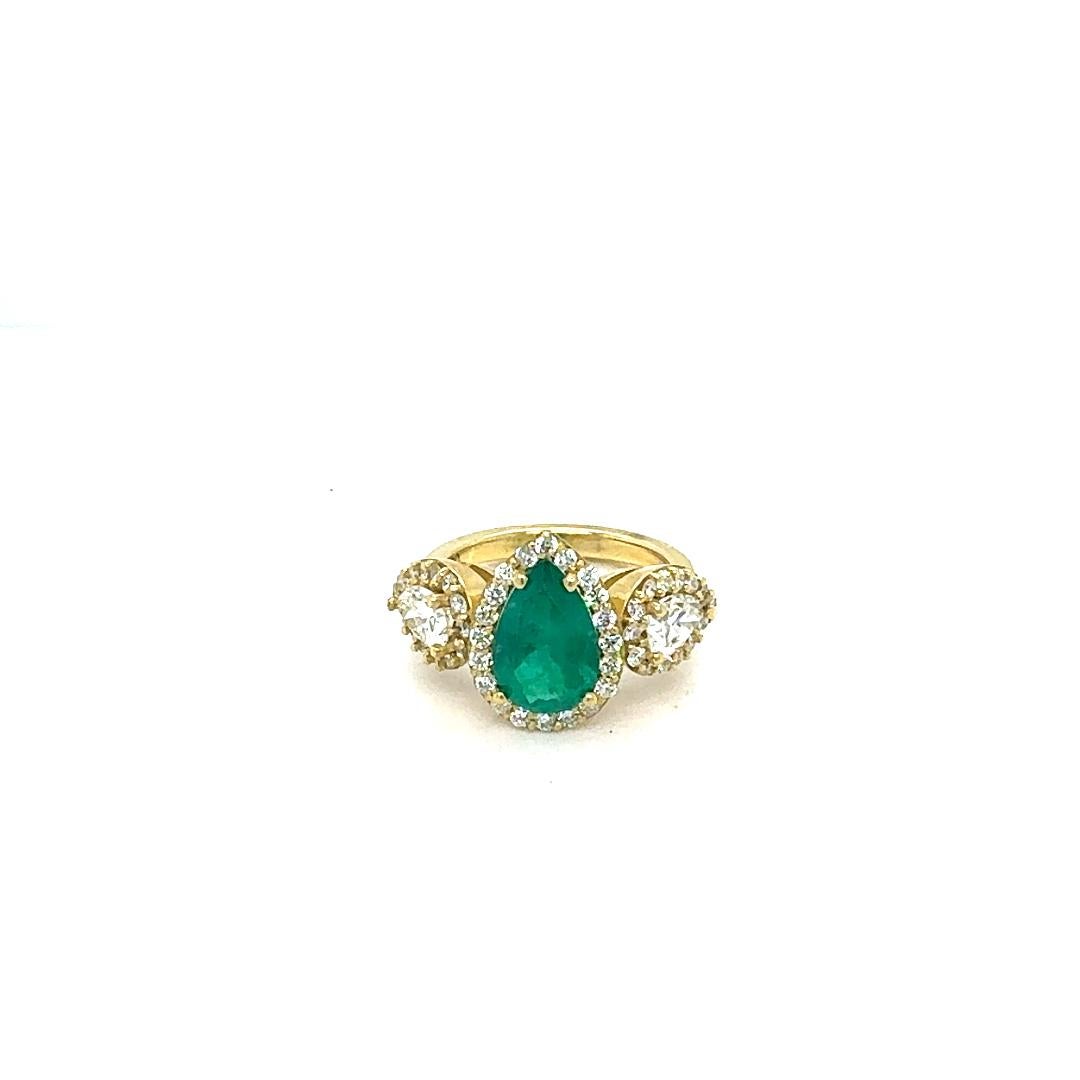 GIA Certified 3.69 Carat Colombian Emerald Diamond 18 Karat Yellow Gold Ring

This Emerald ring is absolutely gorgeous. The center is an Pear Cut Colombian Emerald which weighs 1.87 Carats and measures in at 11.2mm x 7.3 mm.  The Emerald is graded