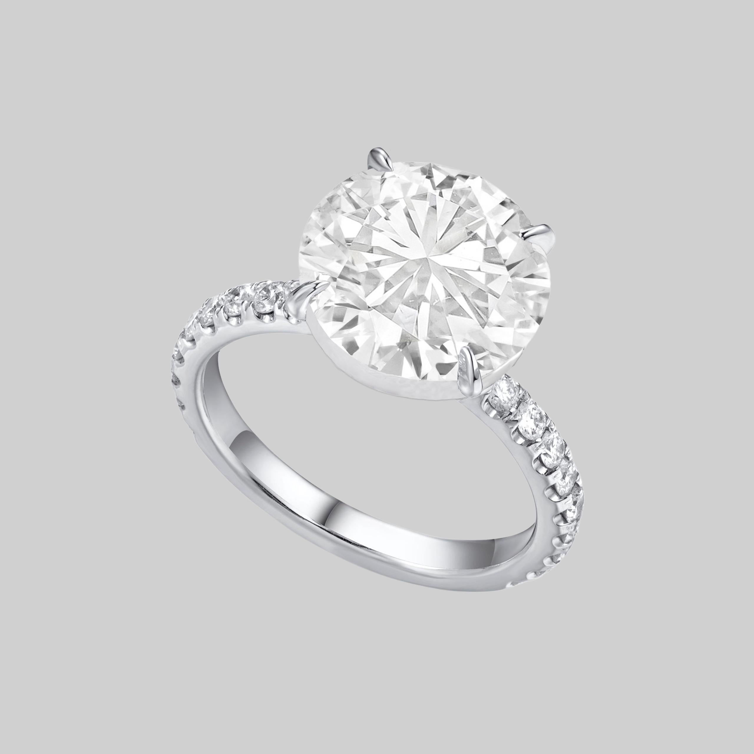 dazzling and substantial 3.70 carat round brilliant cut diamond is bright white, completely eye clean, and impeccably finished! Cut with absolutely ideal proportions, it displays truly phenomenal sparkle! The diamond is certified by GIA, the world’s
