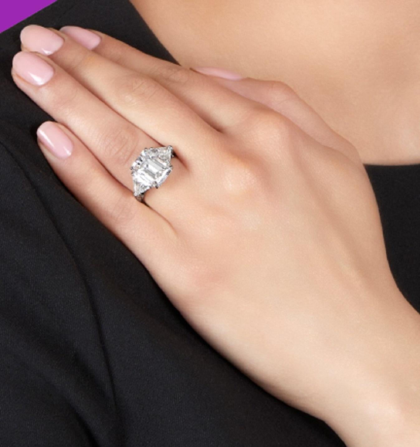 emerald cut diamond with trillion side stones