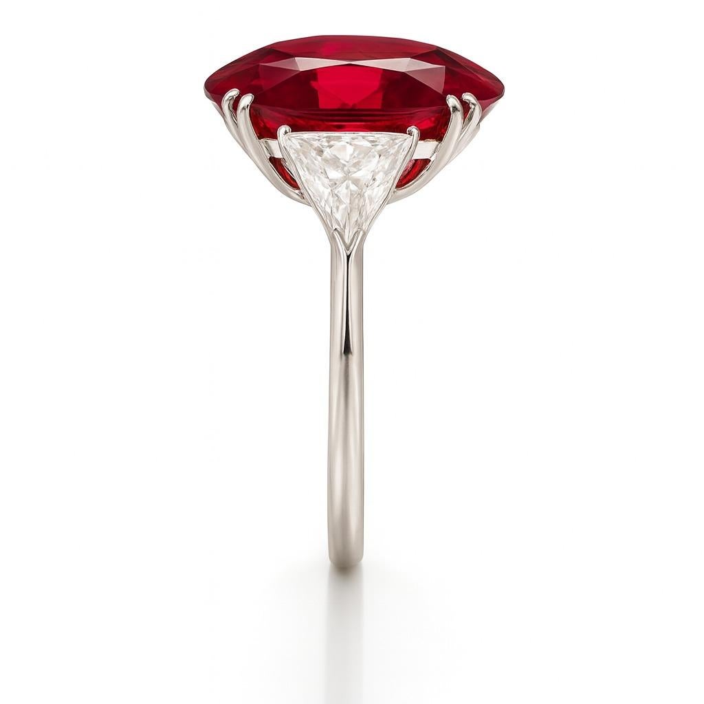 GIA Certified 3.73 Carat Ruby and Trillion Cut Diamond Platinum Ring

A magnificent ring featuring a GIA Certified 3.73 Carat Natural Ruby of fine red color, oval brilliant cut with step-cut pavilion, displaying exceptional transparency and