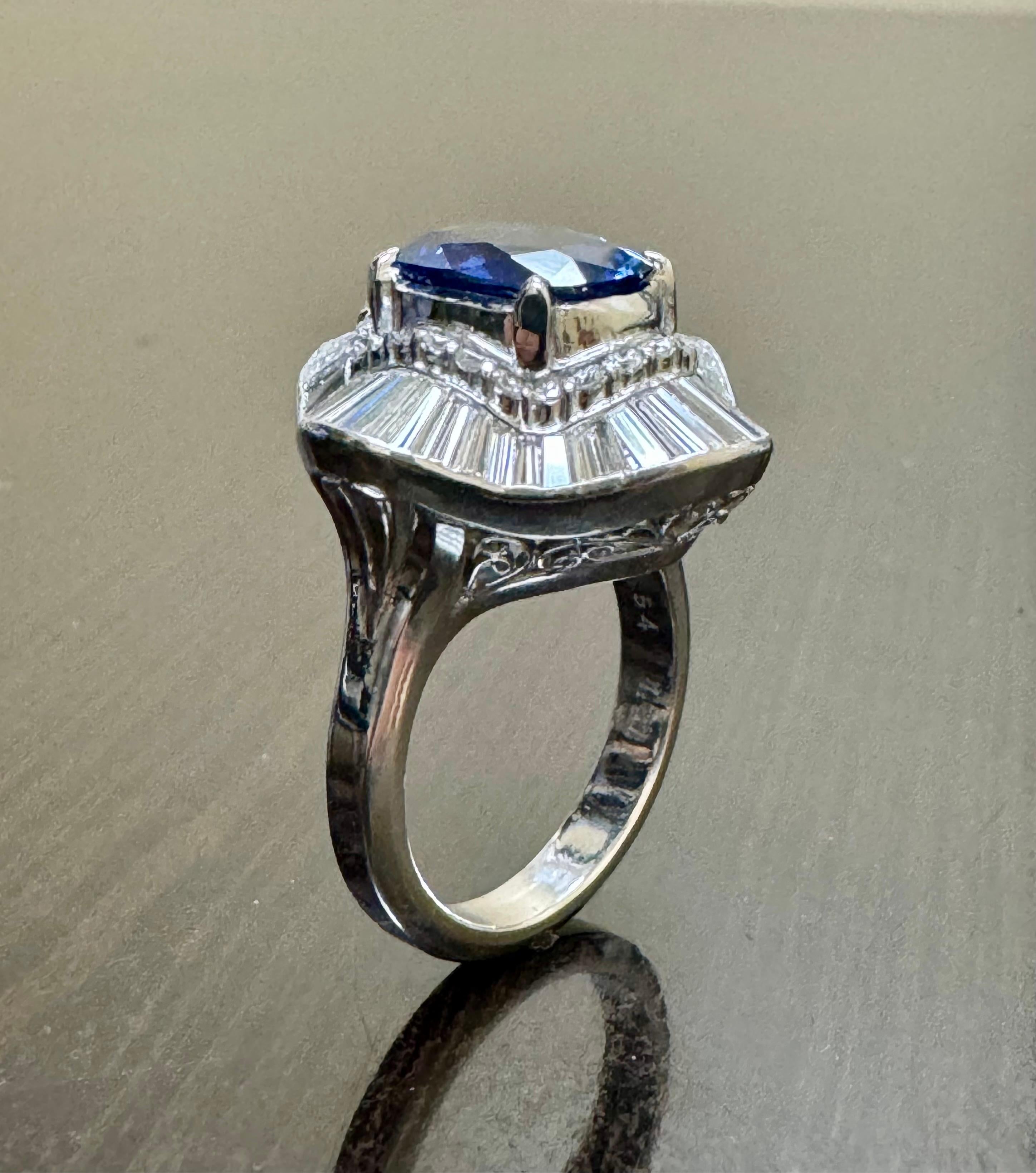 Art Deco GIA Certified 3.74 Carat Oval Blue Sapphire Baguette Diamond Engagement Ring For Sale