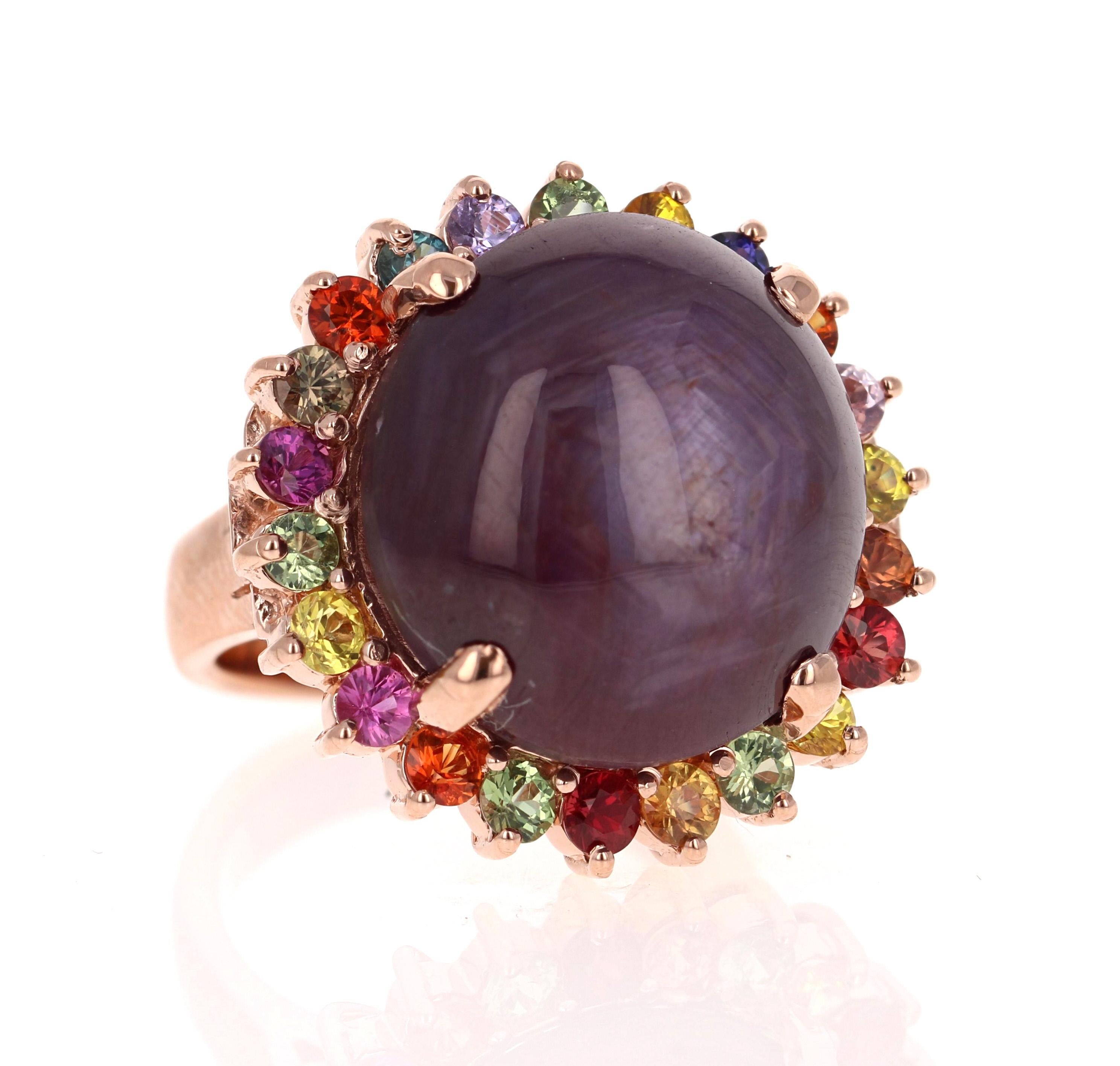 Una auténtica joya - Anillo de cóctel de rubí estrella y zafiro multicolor de 37,55 quilates en oro rosa de 14 quilates

Este anillo tiene un magnífico rubí estrella de corte redondo de 34,96 quilates que no está calentado. 
El rubí está certificado