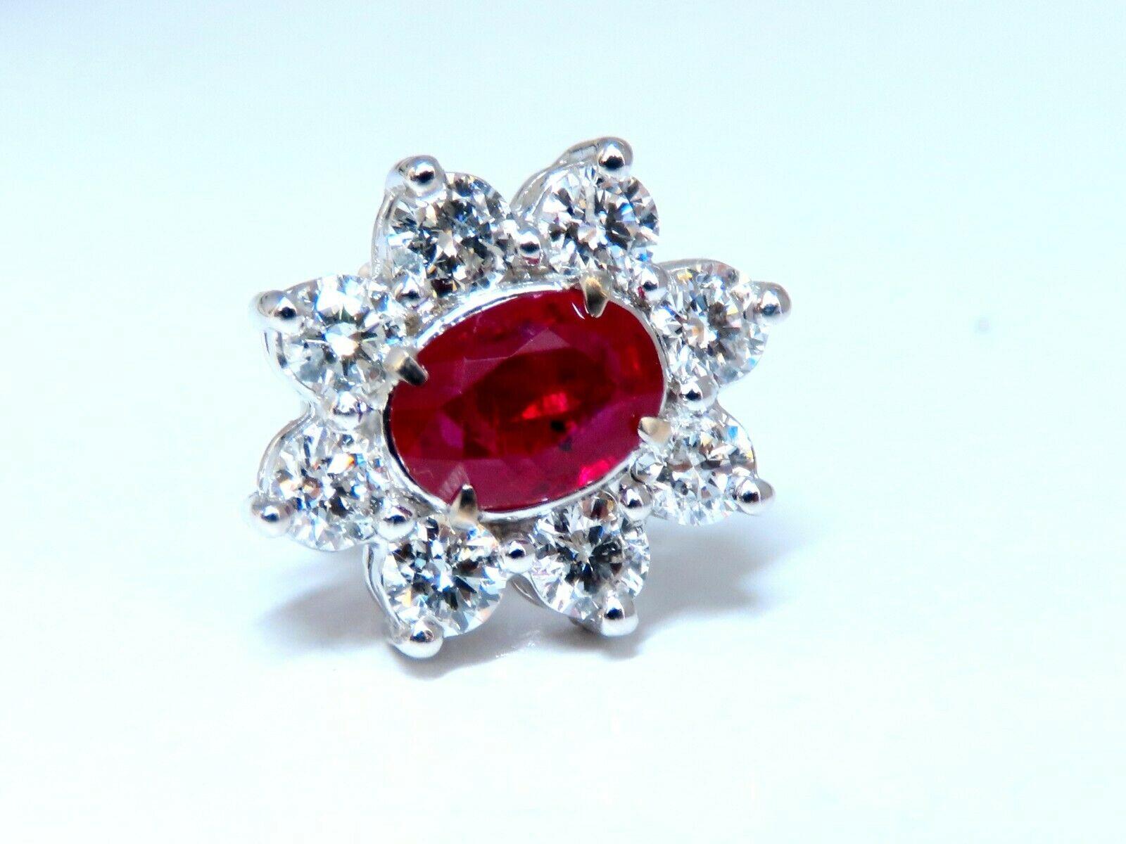 Ruby Cluster Glamour 

GIA Certified: 

.95 & .96ct. Natural Red Rubies

Clean clarity, full oval shape cuts 
Report # 2185151822 & 6187151812 (To Accompany)

All transparent. Heat.

Diamonds: 1.86ct.
full cut rounds

 G color / Vs-2 clarity.

14KT