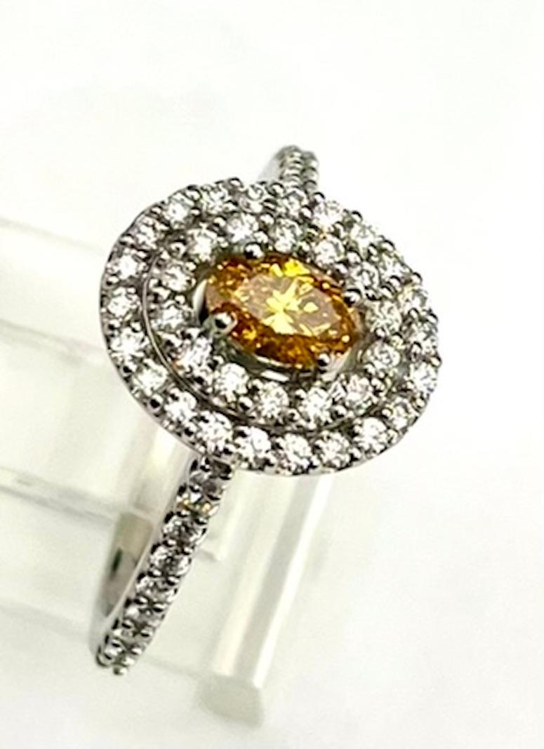 Oval Cut GIA Certified .37Ct Oval Natural Fancy Vivid Yellow-Orange Diamond Ring For Sale
