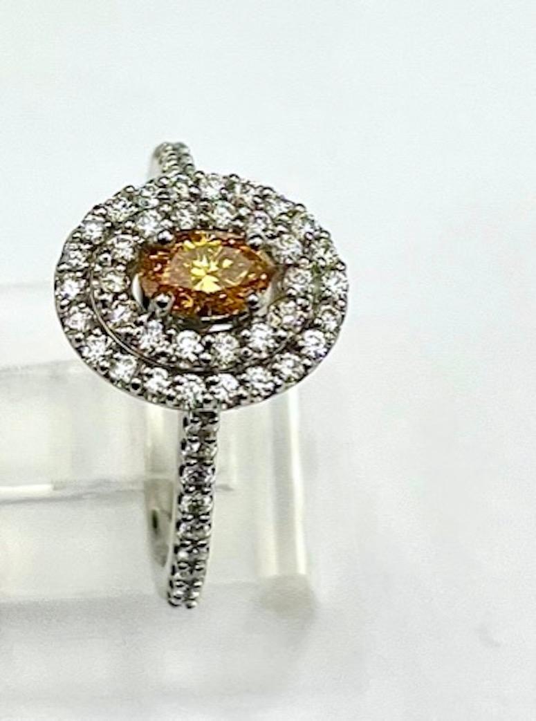 GIA Certified .37Ct Oval Natural Fancy Vivid Yellow-Orange Diamond Ring In New Condition For Sale In San Diego, CA