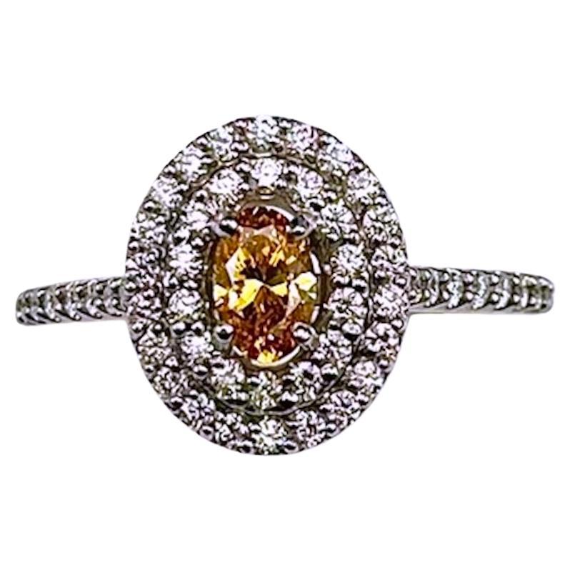GIA Certified .37Ct Oval Natural Fancy Vivid Yellow-Orange Diamond Ring For Sale