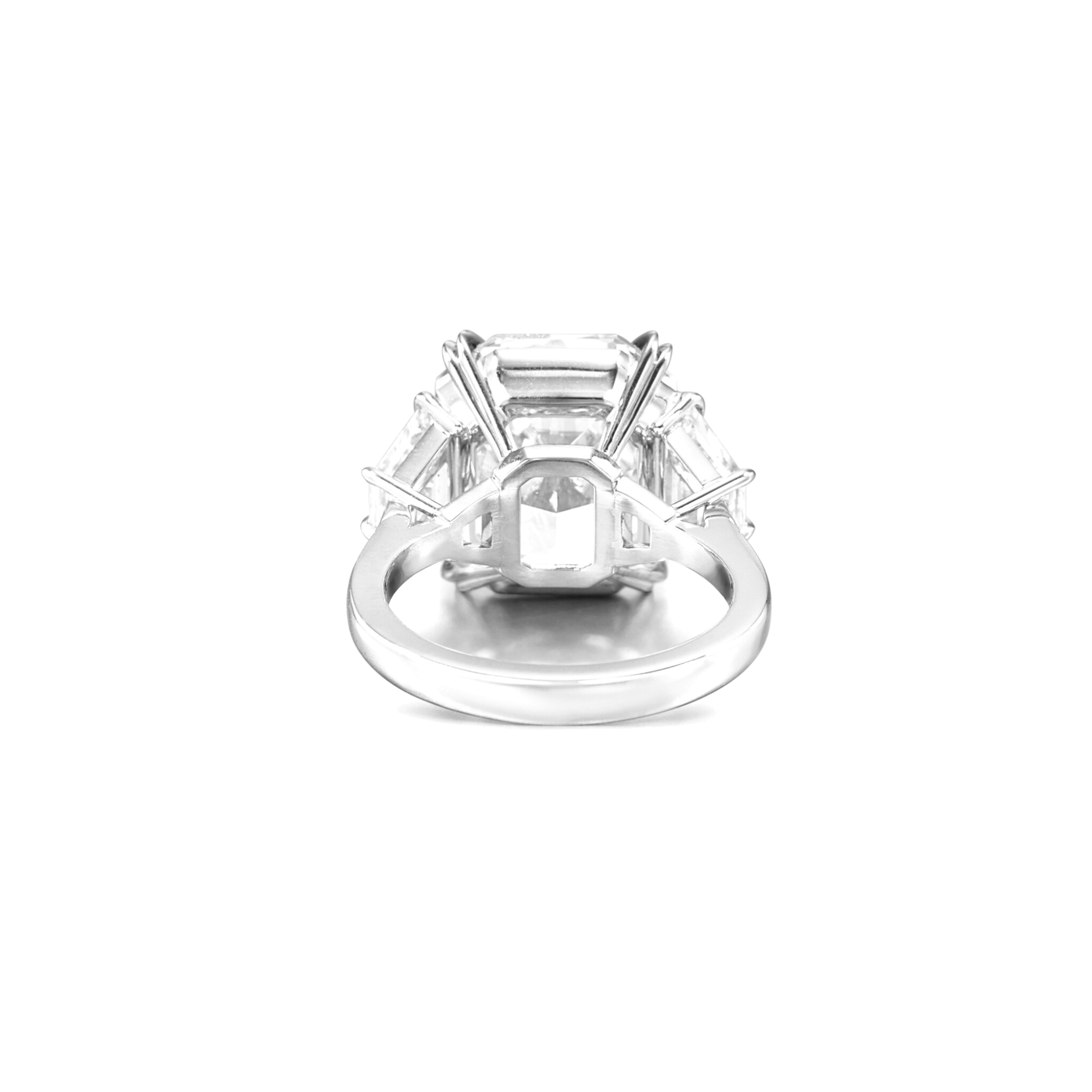 This exquisite three-stone engagement ring showcases a stunning GIA-certified 3.81 radiant cut diamond, set in a refined platinum mounting. The center diamond boasts an D color and flawless clarity, with excellent polish and symmetry
