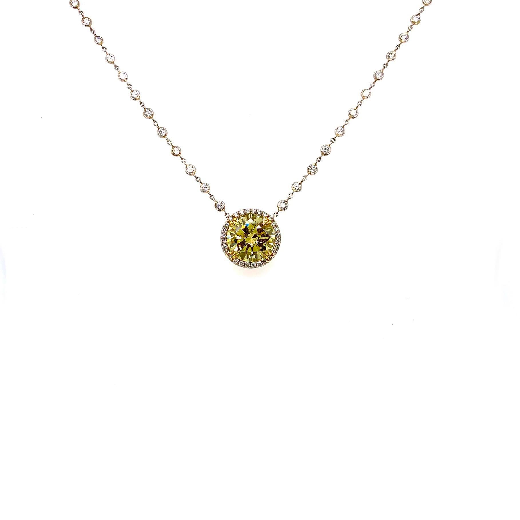 Massive looking pendant. Featuring a fancy yellow round brilliant cut Diamond with a 3.82 total carat weight.
Graded by the GIA to be natural in color SI1 in clarity. This stone exhibits full saturation.
Suspended from a handmade platnium chain with