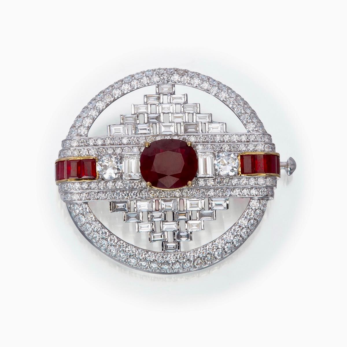 This unique masterpiece made in ruby and diamond brooch featured by Rewa jewels, in 18 karat white gold.

It has a vibrant ruby of Burmese origin GIA Certificate number is 2446097634, no heat, 
