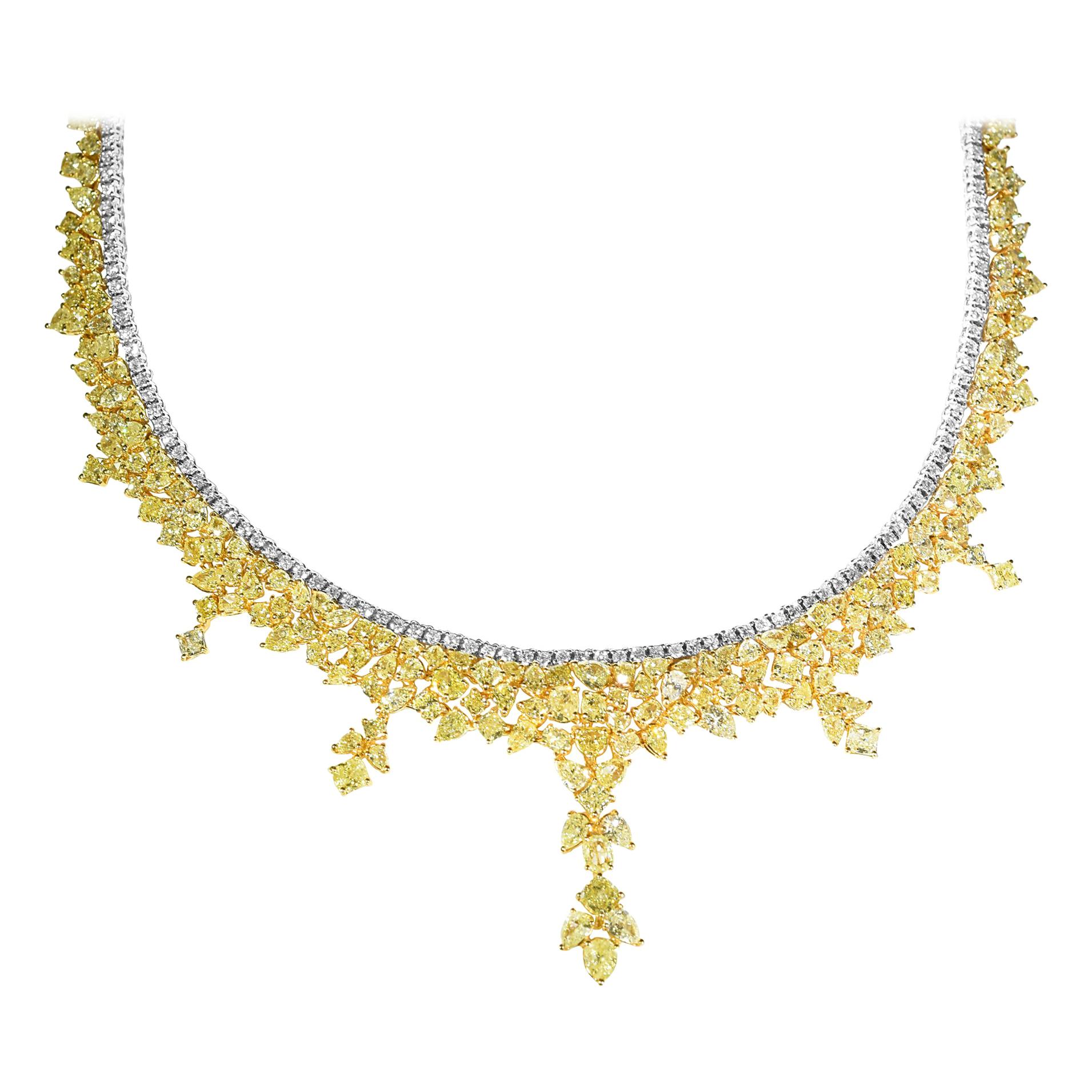 This exquisite GIA Certified 38.33 Carat fashion Natural Yellow Diamond Necklace features 34.23 Carats of Natural Yellow Diamonds and 4.10 Carats of White Diamonds. This magnificent necklace is set in 18 Karat Yellow and White Gold and weighs 48.60