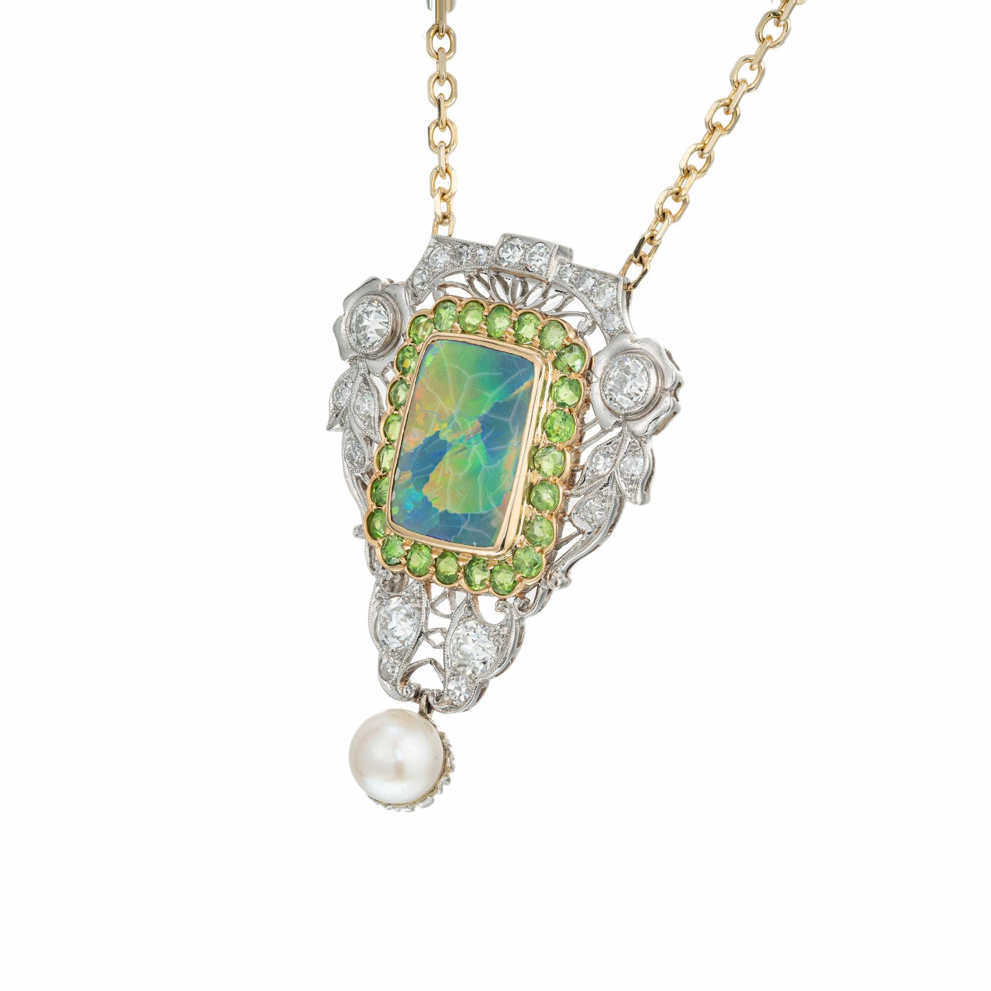 Original 1915 Edwardian opal, diamond and pearl pendant necklace. GIA certified 3.85ct center opal tablet in a handmade platinum and 18k yellow gold setting with 24 round old European cut green demantoid garnets, 4 old European cut diamonds, 18