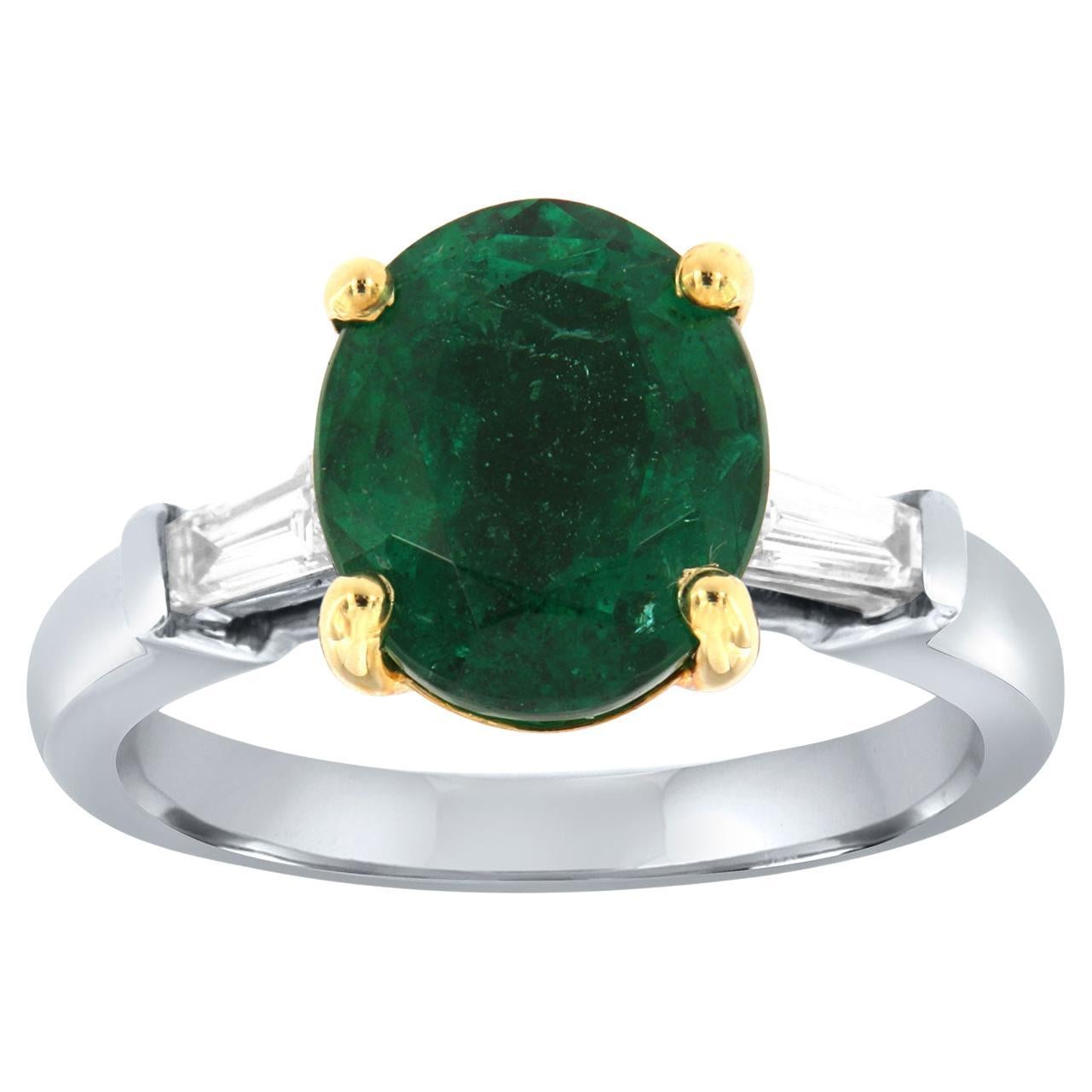 Anillo de platino y 18 quilates con diamante baguette de esmeralda verde de forma ovalada certificado por GIA de 3,86