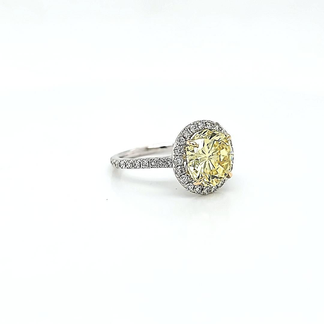 Round Cut GIA Certified 3.87 Carats Fancy Yellow Diamond Ring For Sale