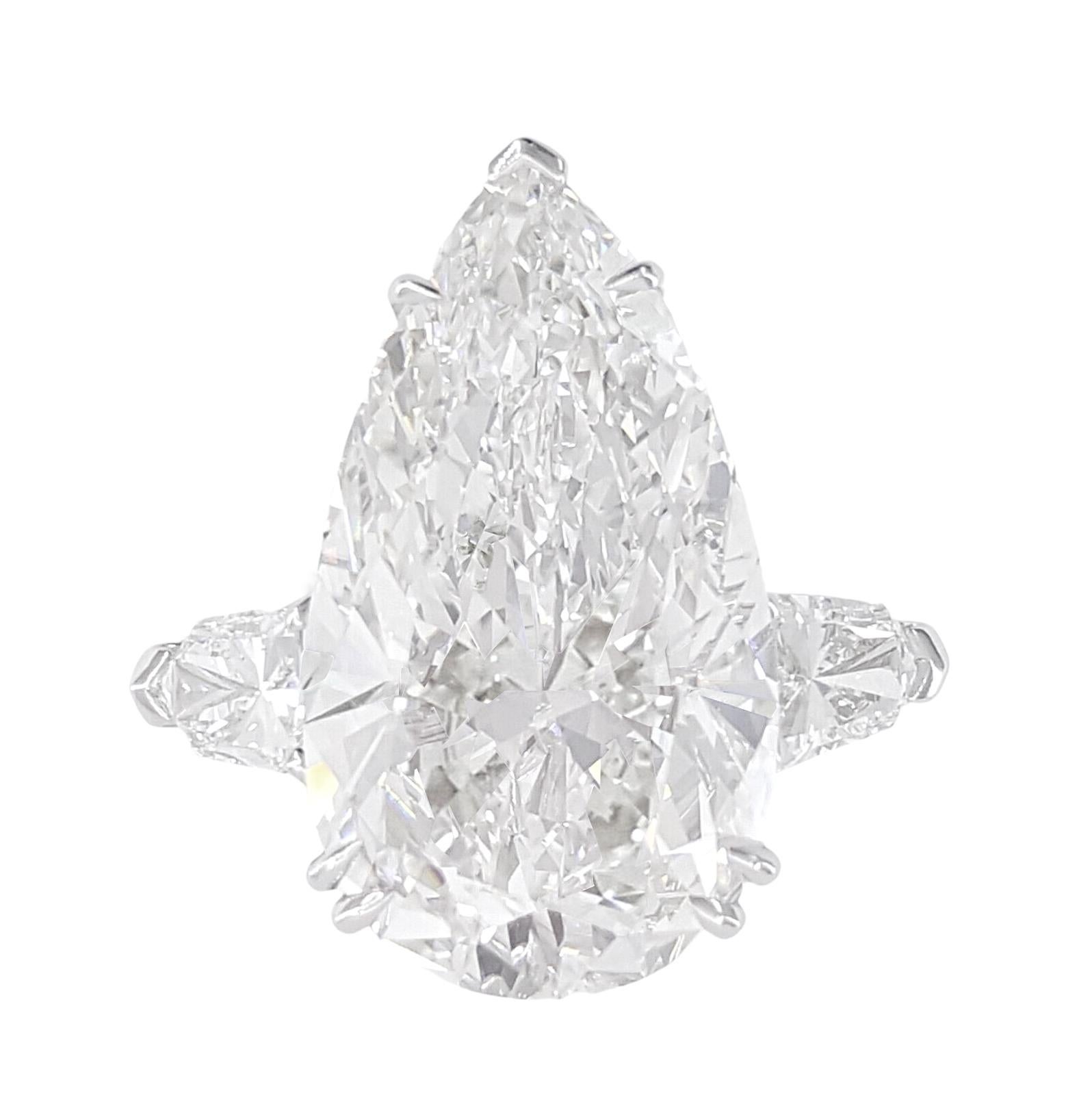 exquisite 3.90-carat pear-cut diamond ring, a true testament to timeless elegance and unparalleled craftsmanship. Each facet of this mesmerizing gem has been meticulously inspected and certified by GIA, ensuring authenticity and exceptional quality.