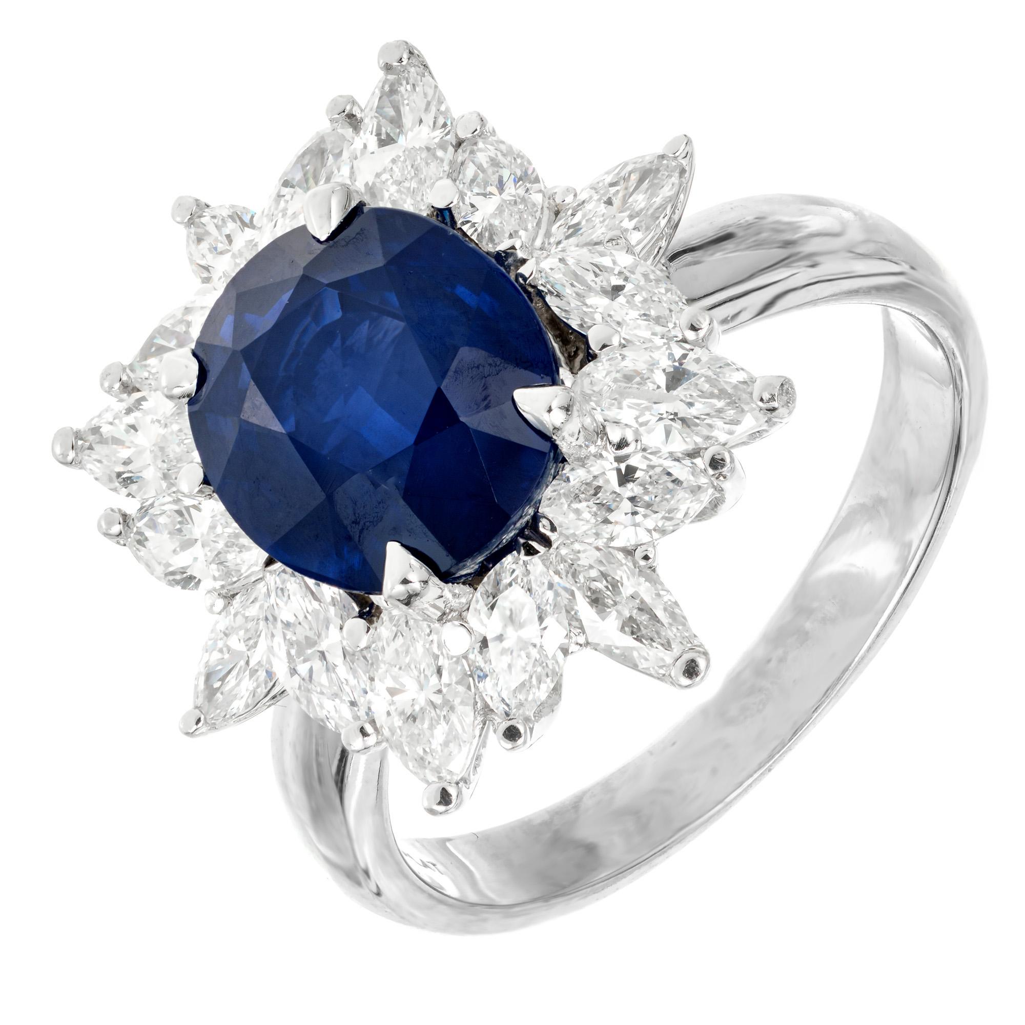 1950's Royal blue sapphire and diamond engagement ring.  GIA certified oval 3.93ct center Sapphire set in platinum with a marquise diamond halo. GIA Certified Simple heat only, no other enhancements.

1 oval gem Royal blue Sapphire, approx. total