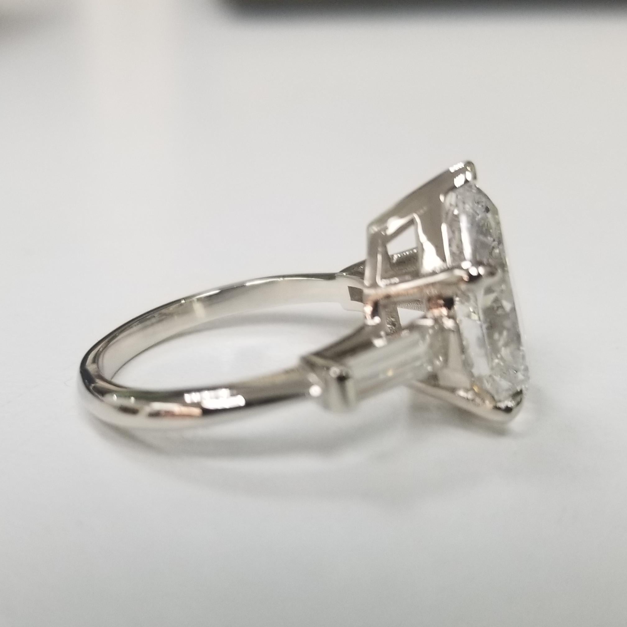 Contemporary GIA Certified 3.95cts. Pear Shape Diamond Color E with 2 Baguettes .50pts