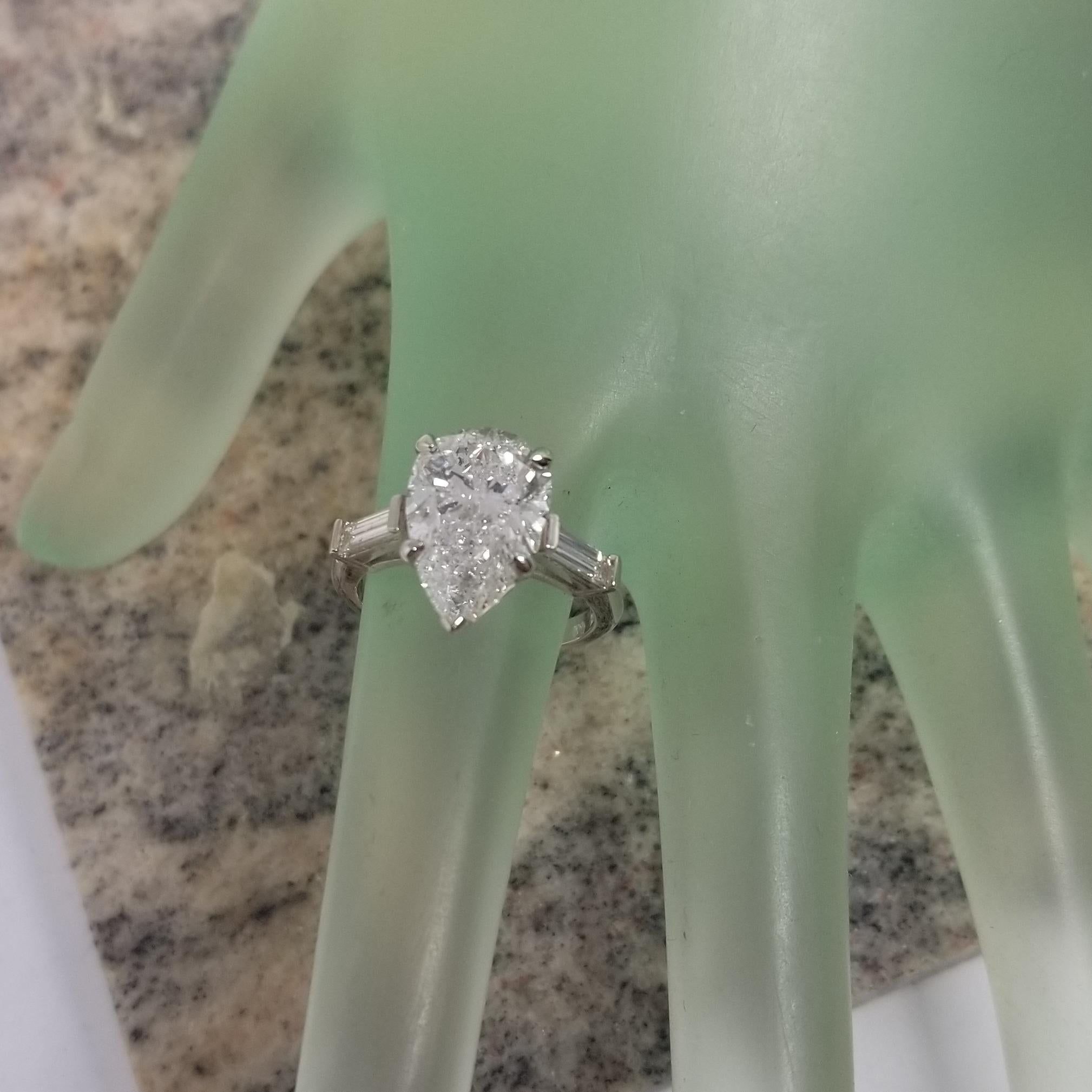 GIA Certified 3.95cts. Pear Shape Diamond Color E with 2 Baguettes .50pts In New Condition In Los Angeles, CA