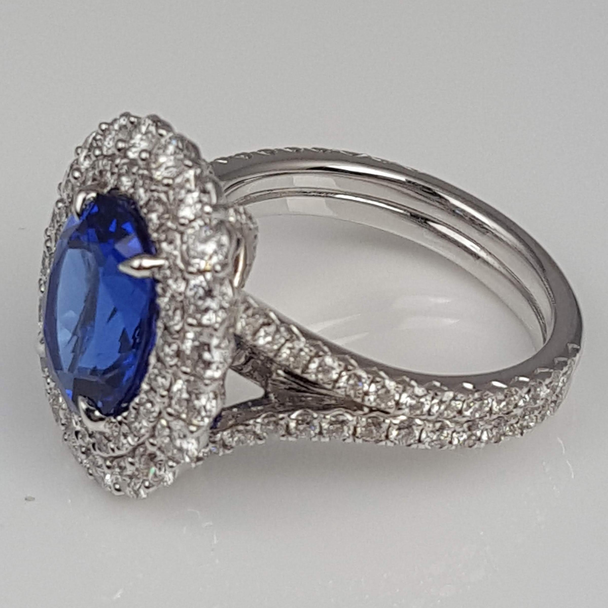 DiamondTown GIA Certified 3.97 Carat Oval Cut Tanzanite and Diamond Halo Ring In New Condition In New York, NY