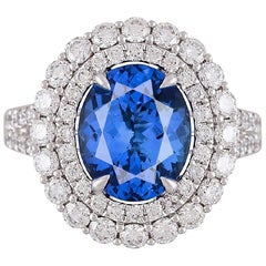 Used GIA Certified 3.97 Carat Oval Cut Tanzanite and Diamond Halo Ring ref632