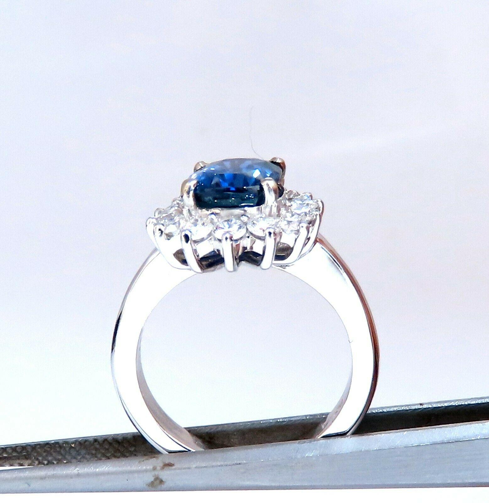 Blue Cluster Halo

GIA Certified 

3.48ct. Natural Sapphire ring.

Report:  6223155583

Cushion cut: 10.31 X 7.43  X 5.83mm

Transparent, Color Change Blue To Purple

No Heat



.95ct. Side natural round diamonds: 

G-color, Vs-2 clarity.

14kt.