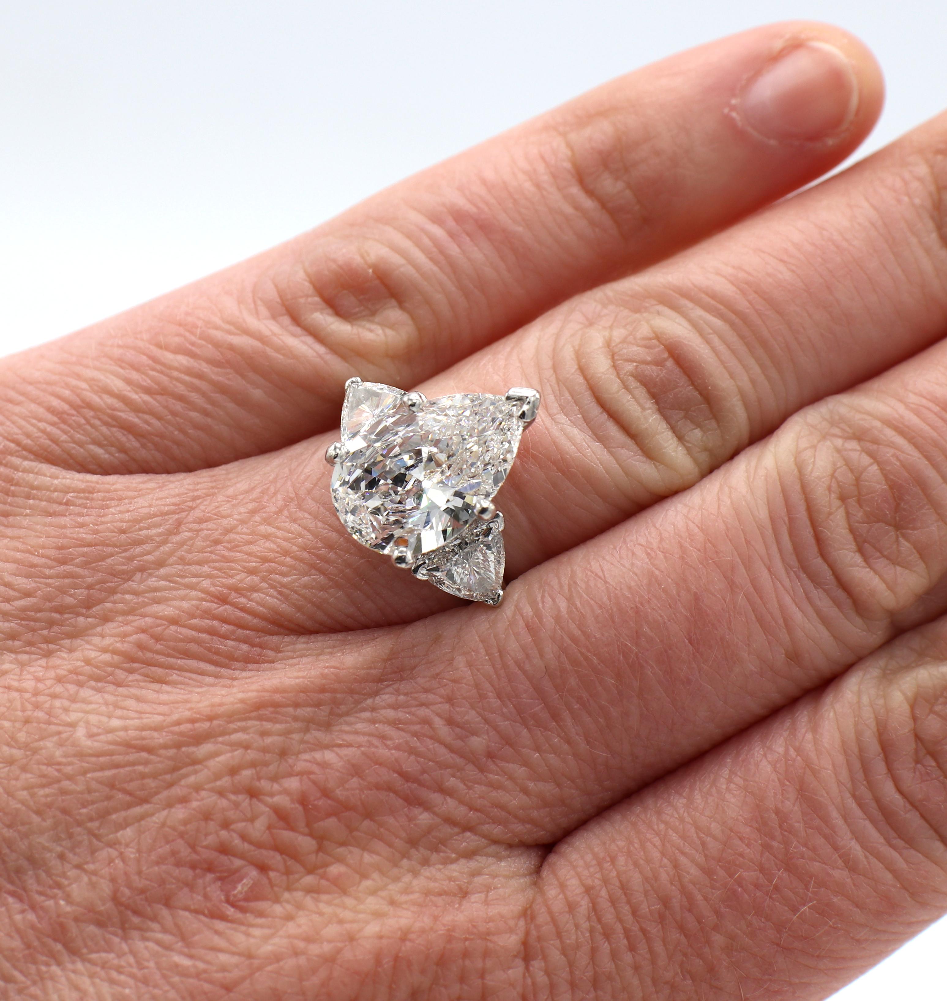 Modern GIA Certified 3.98 Carat Pear Shape Diamond Three Stone Engagement Ring