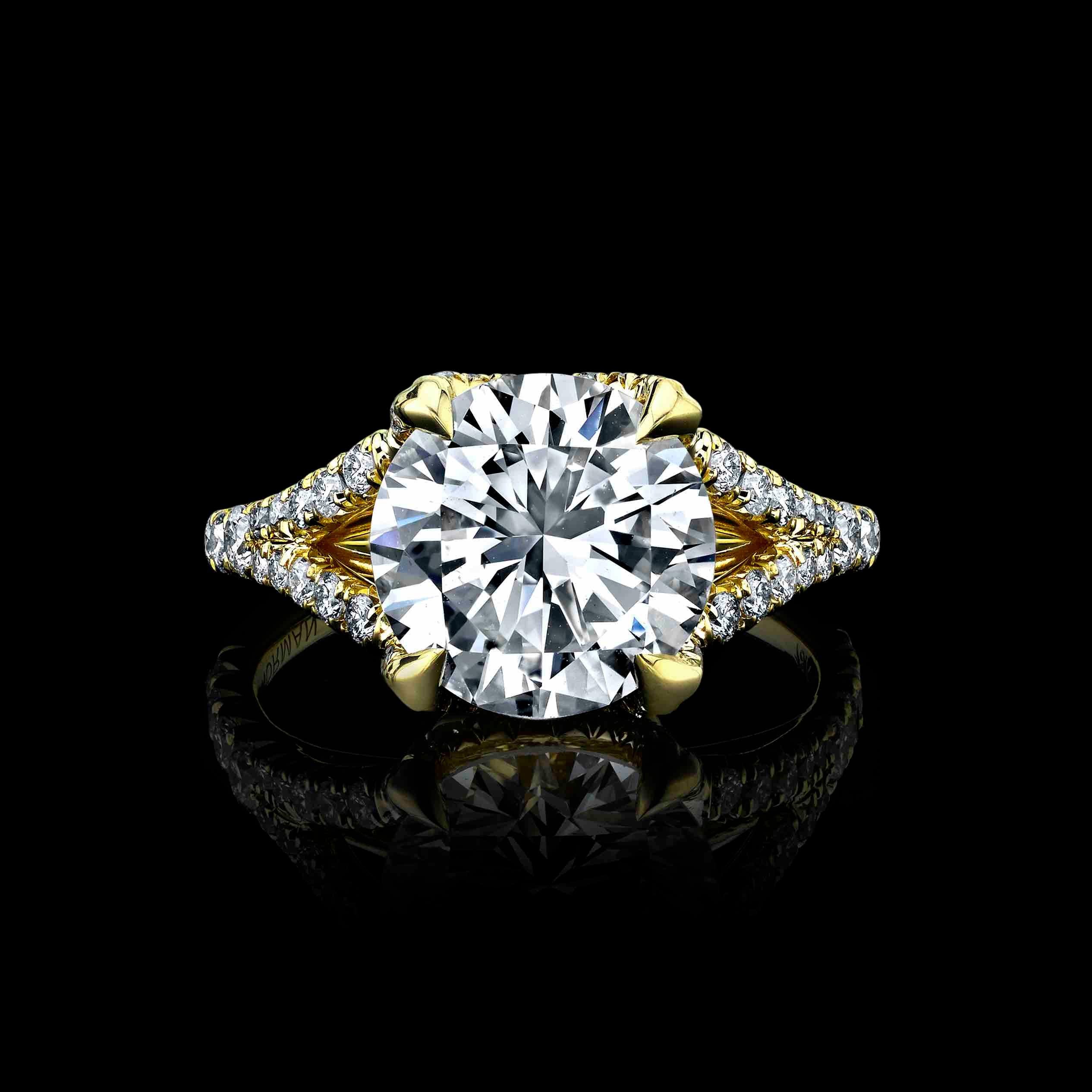 A beautiful 3.98ct, L Color, and SI1 clarity diamond, set in 18K gold ring with 1.00cttw melee round diamonds 
This Diamond is GIA certified #5211433618