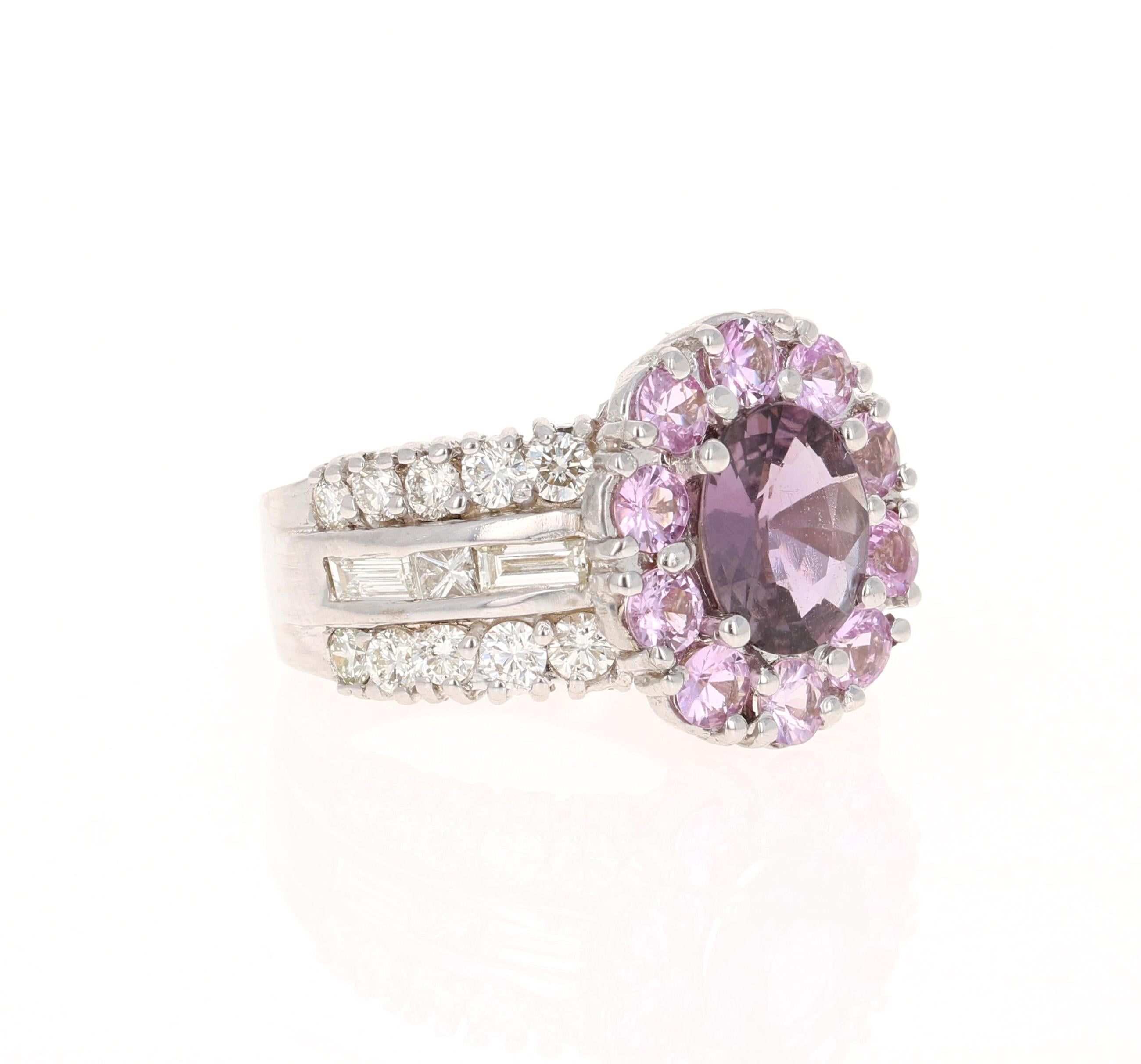 This ring has a Oval Cut GIA Certified Pinkish Purple Sapphire that weighs 1.56 carats. The measurements of the Sapphire are approximately 8.6 mm x 7 mm. It also has 10 Round Cut Pink Sapphires that weigh 1.15 carats. There are Baguette Cut Diamonds