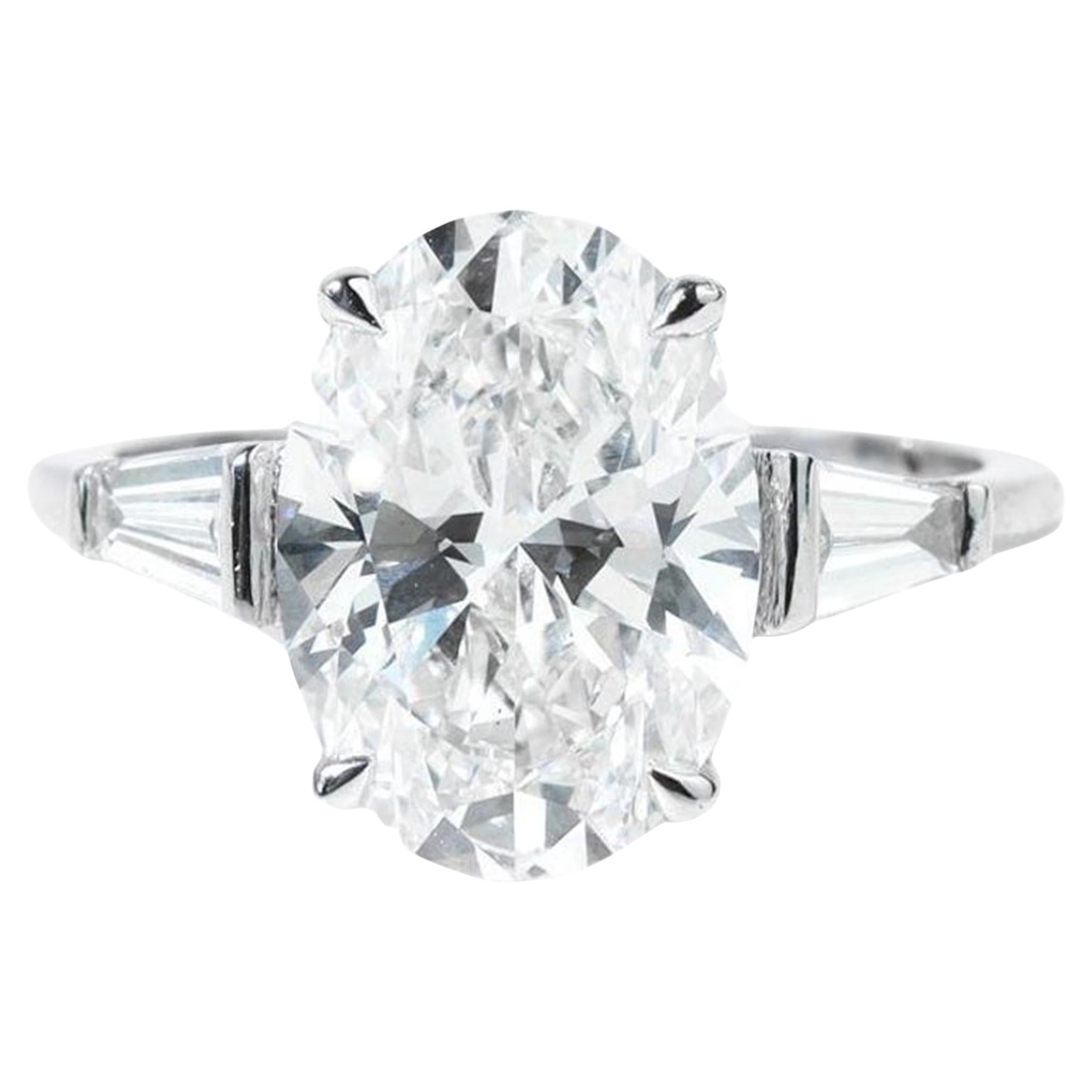 Bague de fiançailles en or blanc 18 carats certifiée GIA avec diamant ovale et baguette de 3 carats