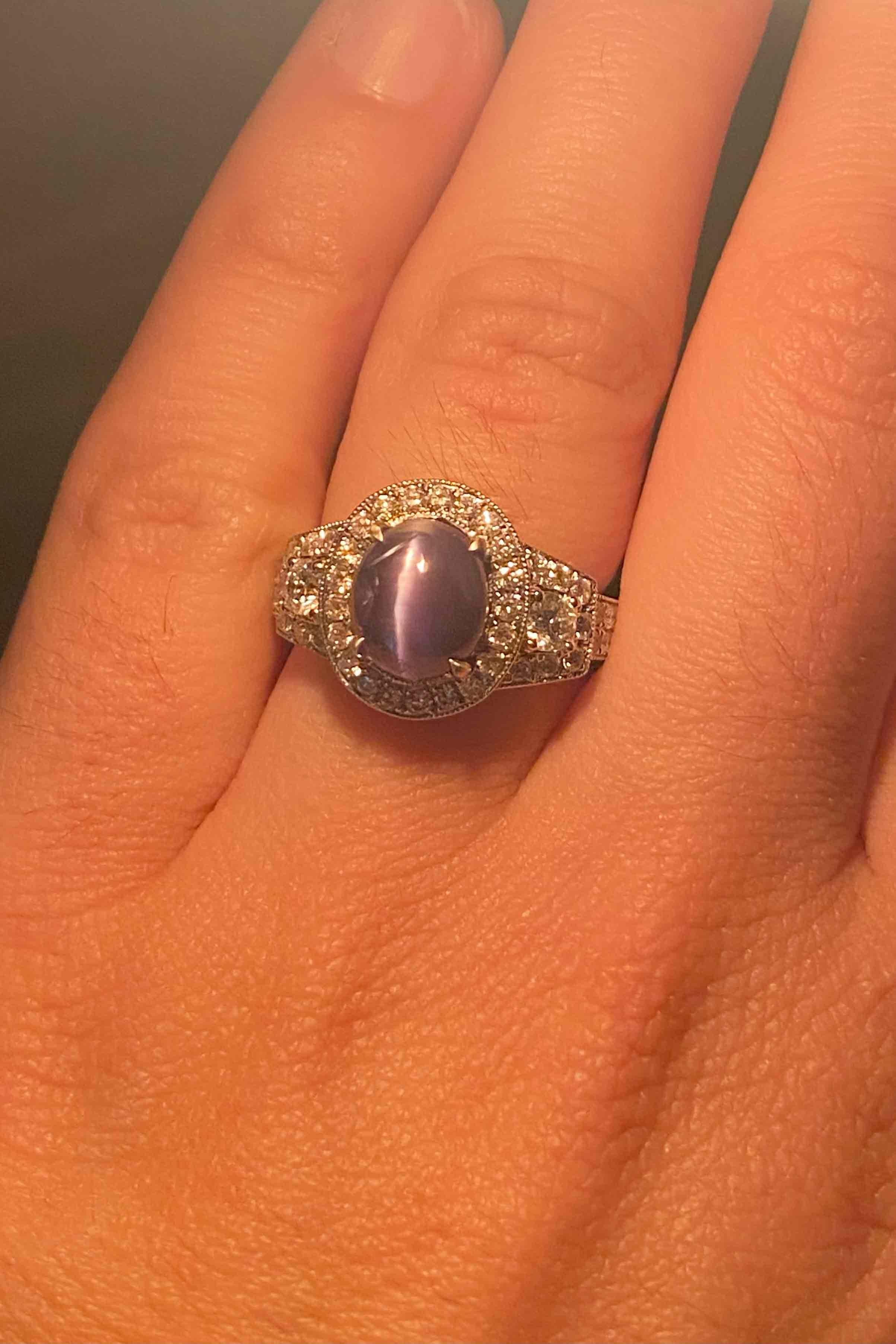 The Eliza cat's eye alexandrite engagement ring is a mesmerizing gemstone. The over 4 carat GIA certified gem displays a distinct color change from blue-green to gray-purple; a true chameleon! This vintage, estate cocktail ring or gemstone