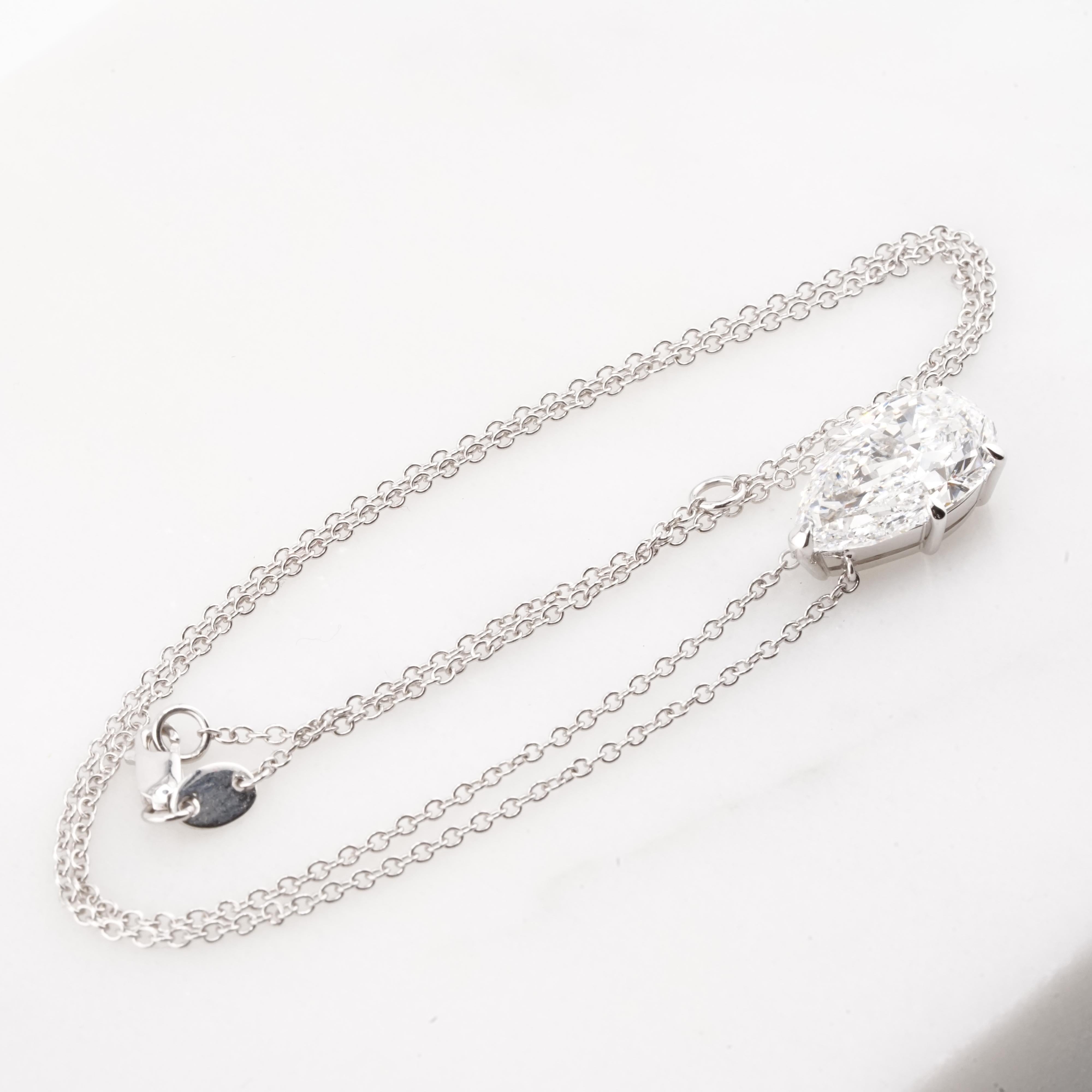 This exquisite necklace features a stunning 4.03 carat pear cut diamond, elegantly suspended as a pendant in 18K white gold. Certified by GIA, the 18K white gold setting complements the diamond’s radiance, providing a sleek and modern finish.

This