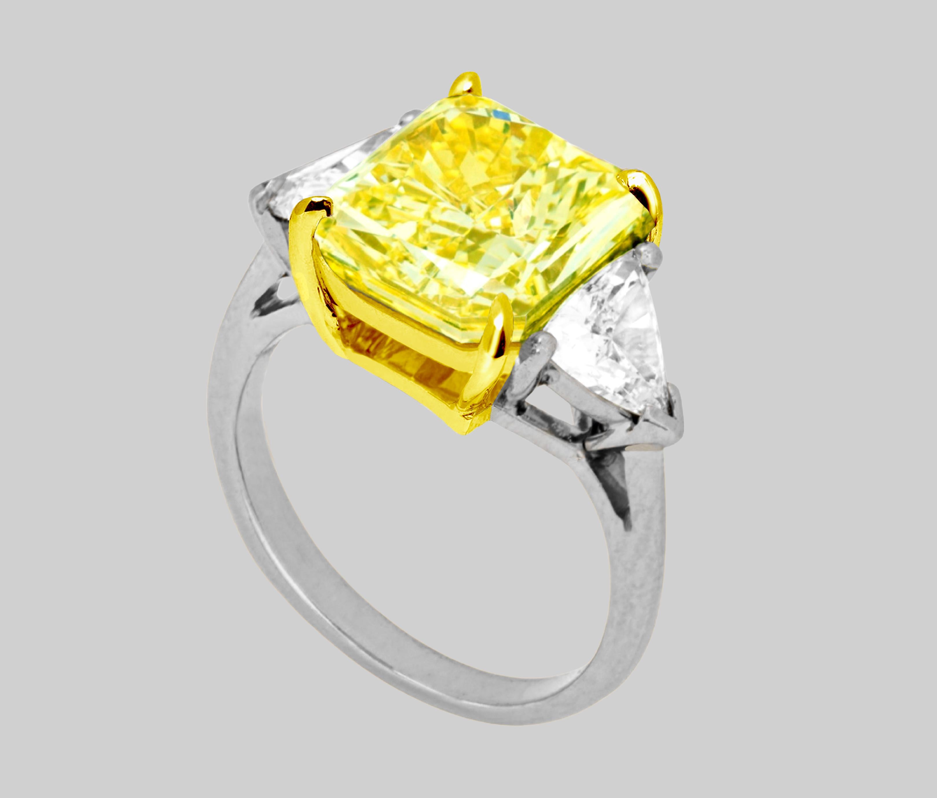 Absolutely, here's a description of this exquisite piece of jewelry:

This magnificent ring features a central diamond that is a true masterpiece of nature and craftsmanship. The main stone is a radiant-cut diamond, weighing an impressive 4.01