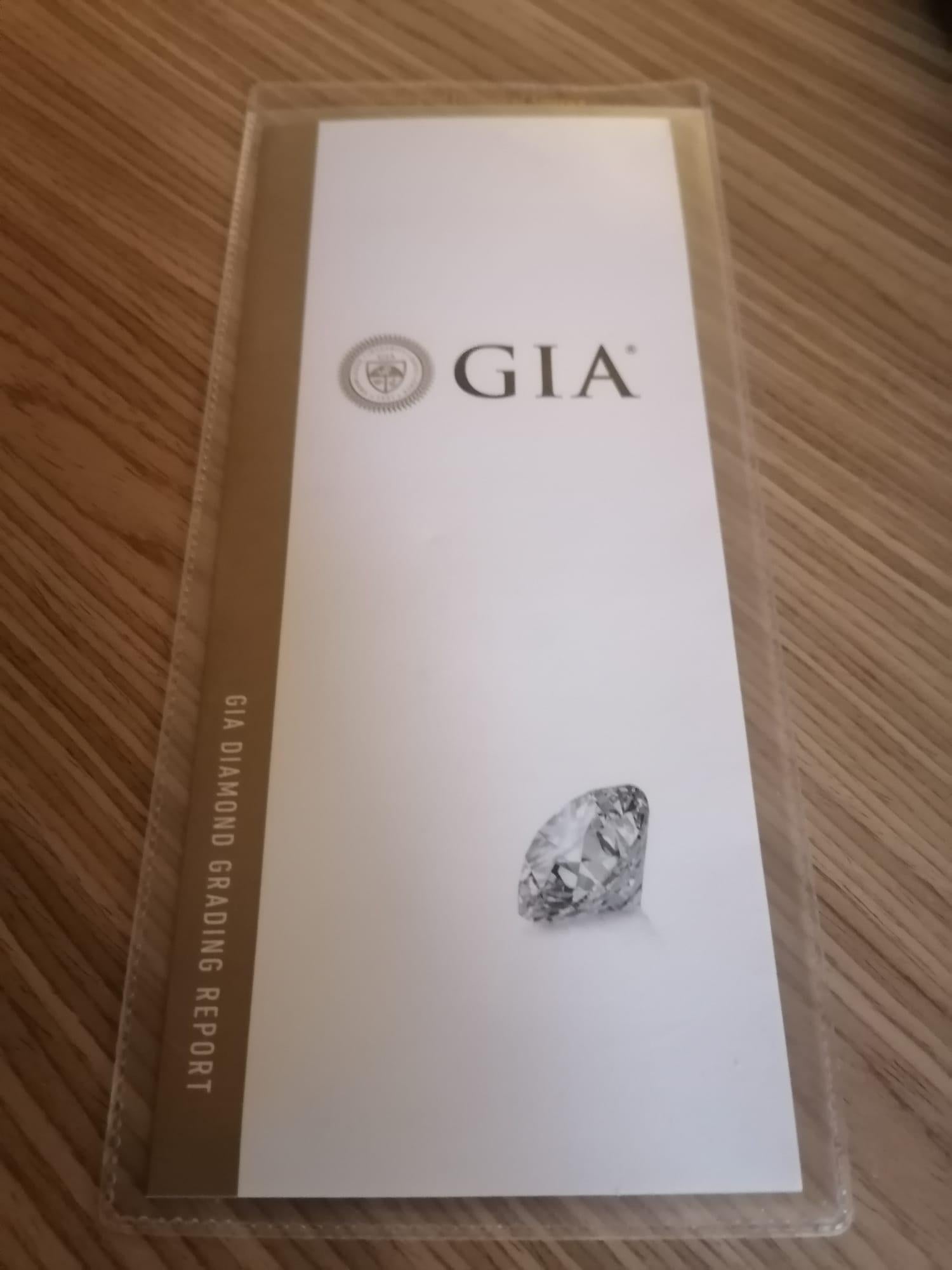 Modern GIA Certified 4 Carat Diamond Studs