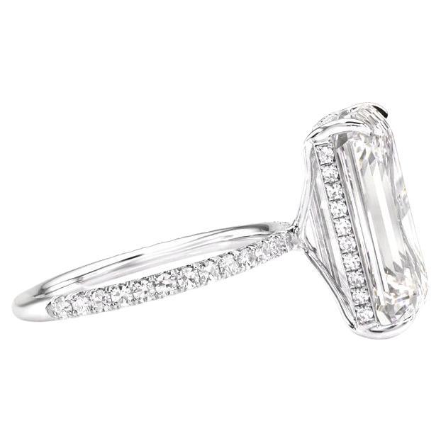 This elegant ring features a GIA-certified 4.02 carat emerald cut diamond, beautifully set in platinum with pavé detailing.

The diamond's F color grade offers exceptional near-colorless brilliance, ensuring a luminous and captivating presence.