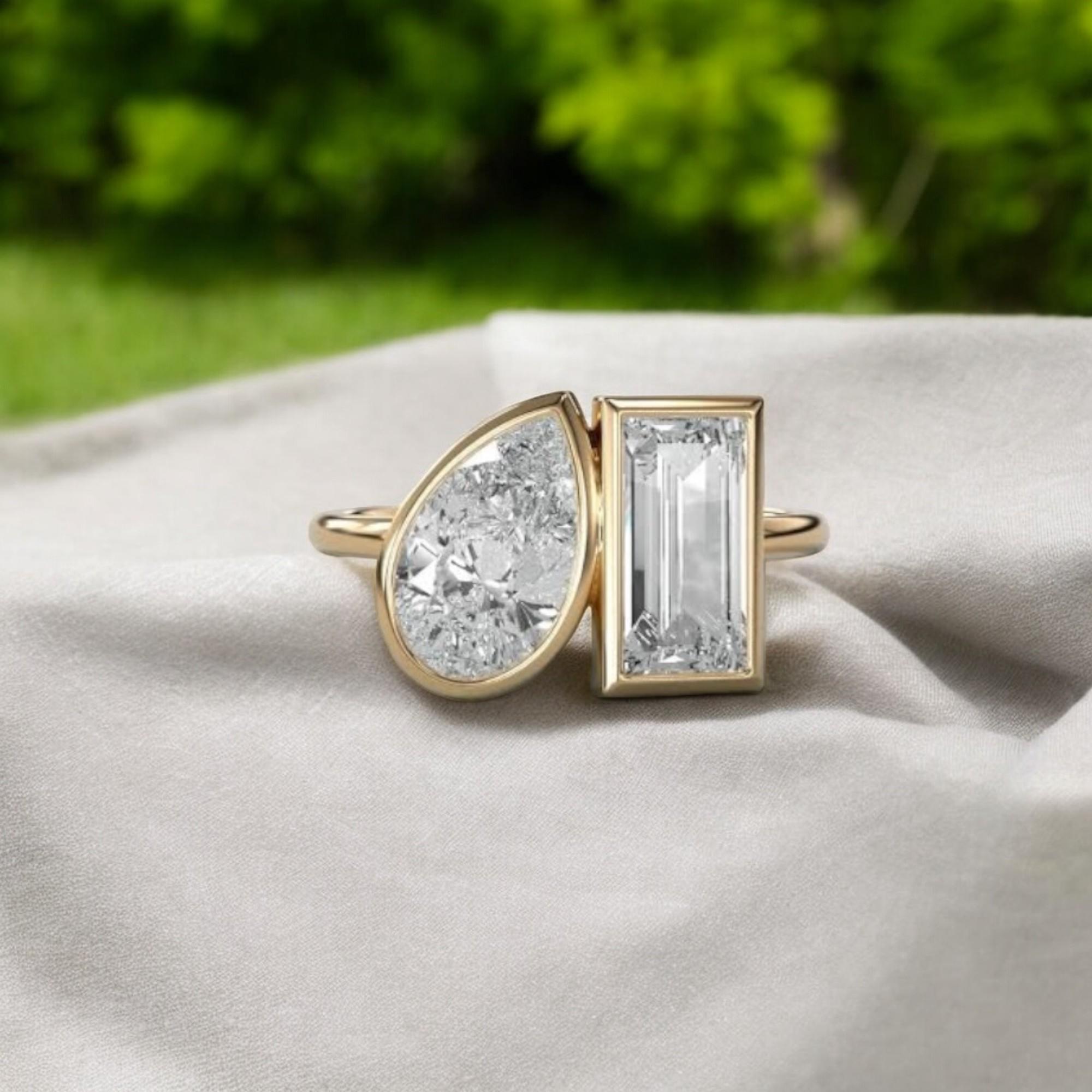 Dieser Ring ist wirklich außergewöhnlich: GIA-zertifizierte 4 Karat F/VS1-Diamanten in Birnen- und Smaragdform, gefasst in einem Toi et Moi-Design aus 18 Karat Gold. Es wird Ihnen zweifellos ein Millionen-Dollar-Lächeln schenken und Sie werden sich