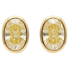 GIA Certified 4 Carat Fancy Yellow VS1 Diamond Earrings in 18K Yellow Gold