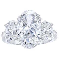 GIA Certified 4 Carat Oval Three-Stone Platinum Ring