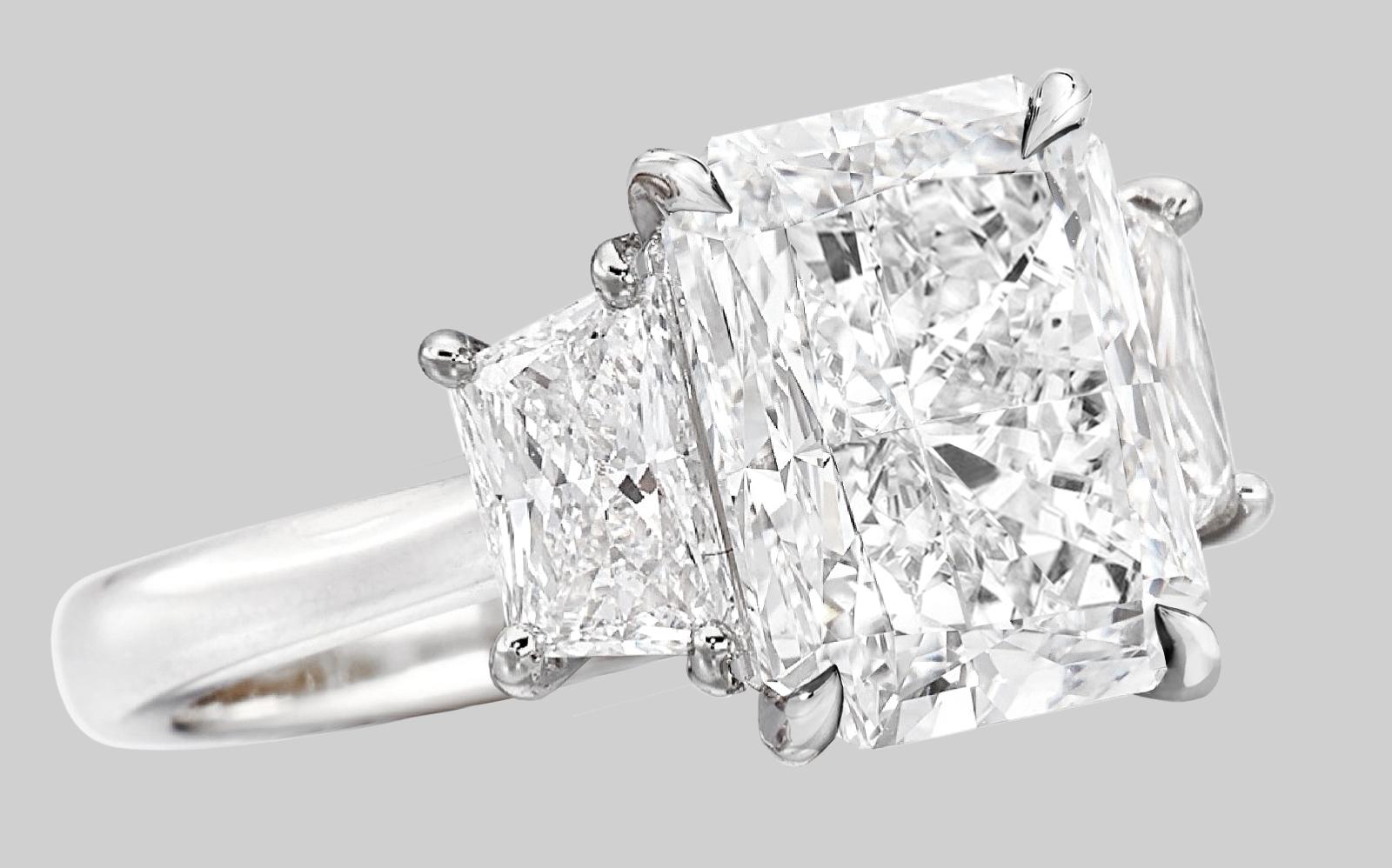 Indulge in the excellence of this extraordinary ring, a true masterpiece of jewelry. Its magnificent center stone, a GIA-certified 4 carat diamond, radiates with unparalleled clarity and purity, boasting an E color grade that enhances its unmatched