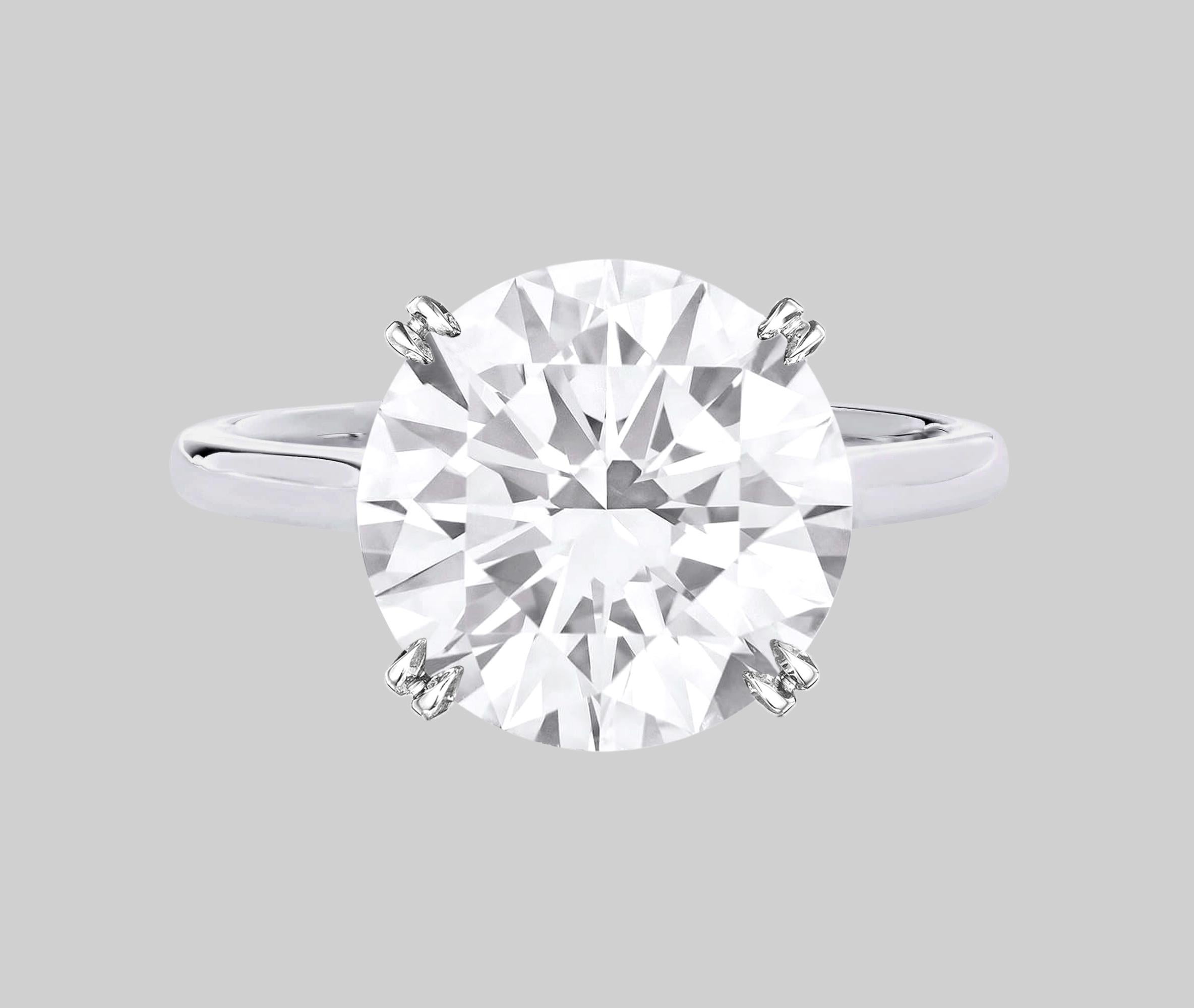 Bague en platine certifiée GIA de 4 carats de diamant rond taillé en brillant

L'éblouissant et substantiel diamant rond de 4 carats de taille brillant est d'un blanc éclatant, d'une propreté parfaite et d'une finition impeccable ! Taillée dans des