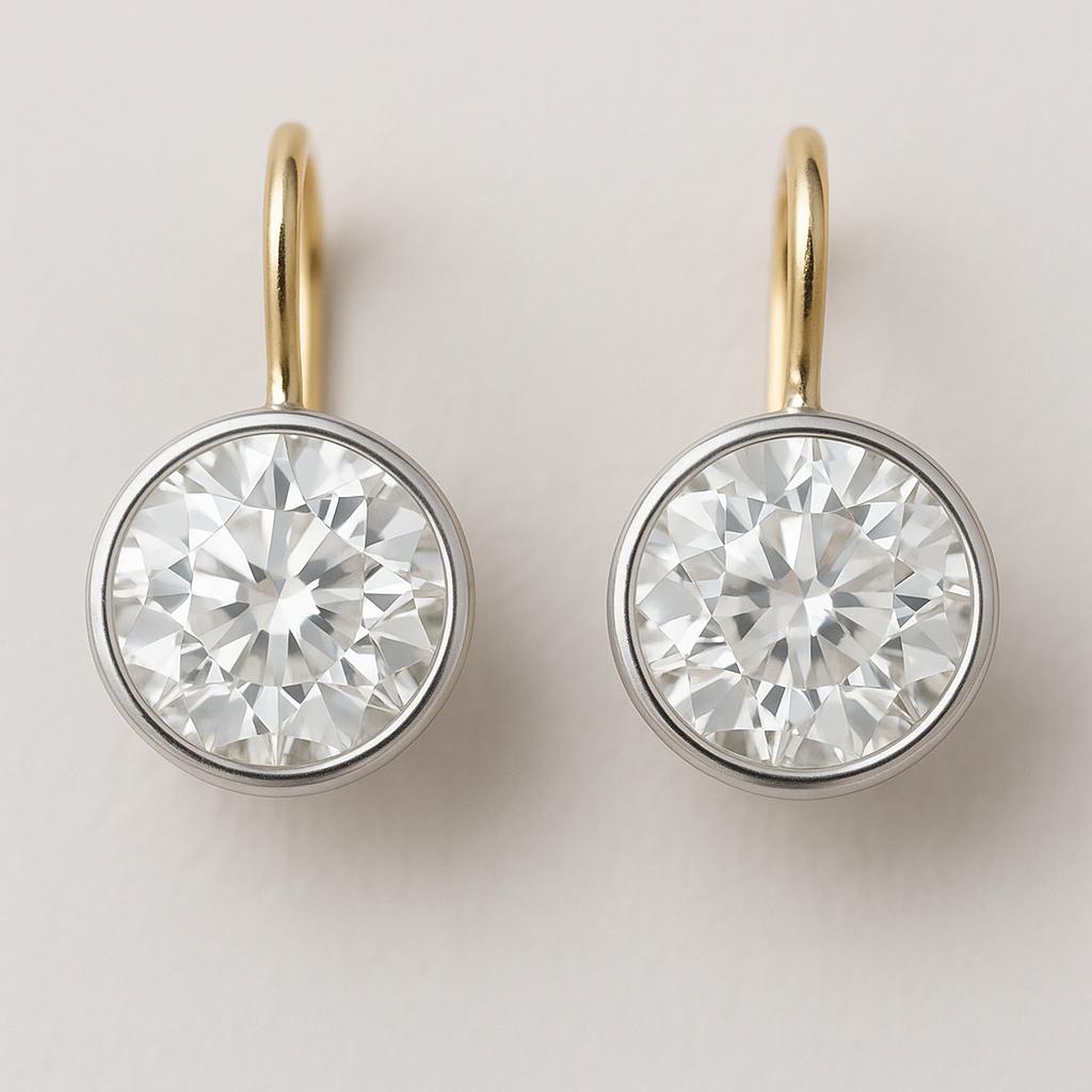 These elegant diamond drop earrings feature an outstanding pair of GIA-certified round brilliant cut diamonds, totaling 4.02 carats. Beautifully matched in size and proportions, each diamond measures approximately 7.88 mm x 7.81 mm, displaying