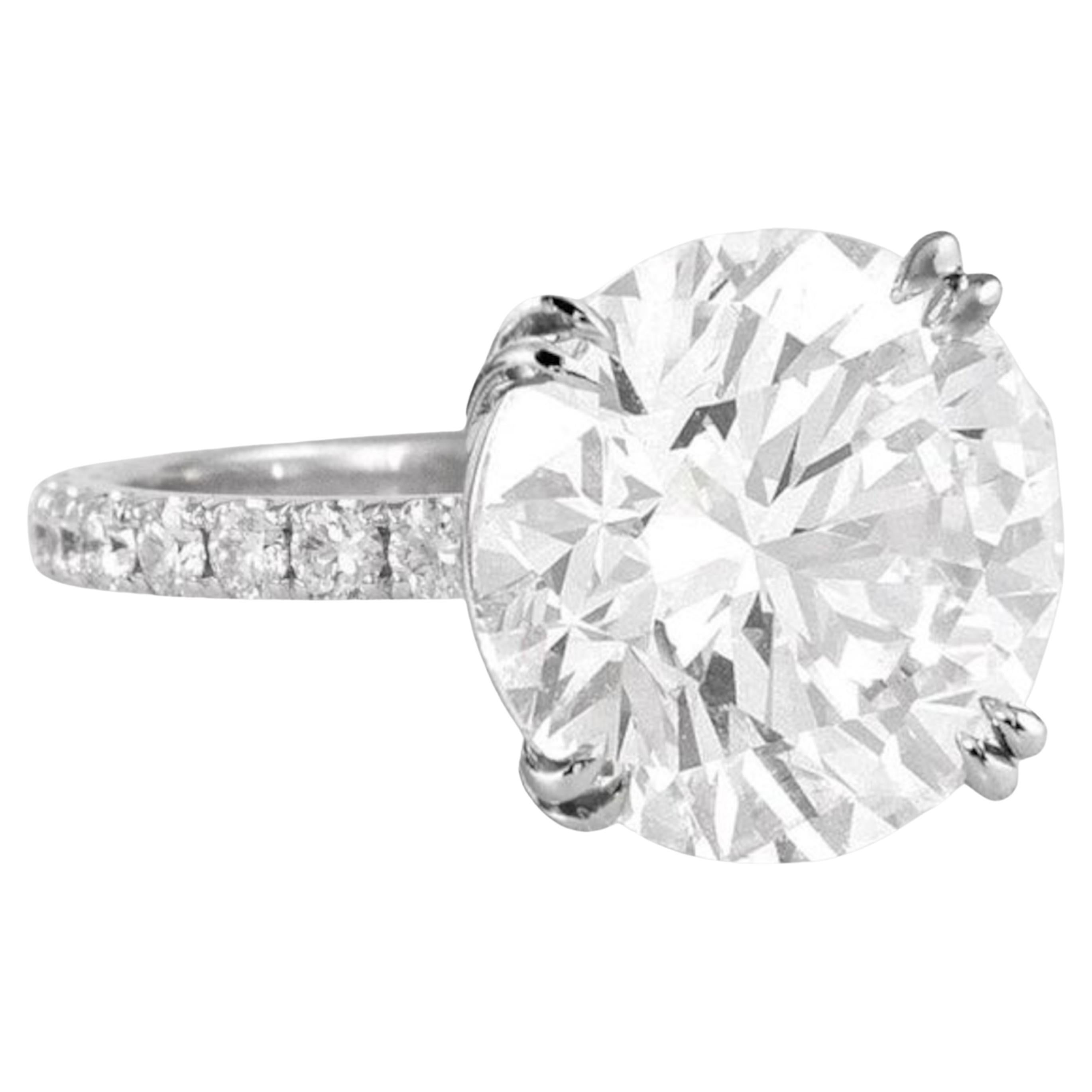an exquisite 4-carat vvs2 clarity round diamond, showcasing a stunning D color with exceptional clarity. This masterpiece features excellent polish and symmetry, ensuring it sparkles brilliantly from every angle. 

Set in a breathtaking pave design