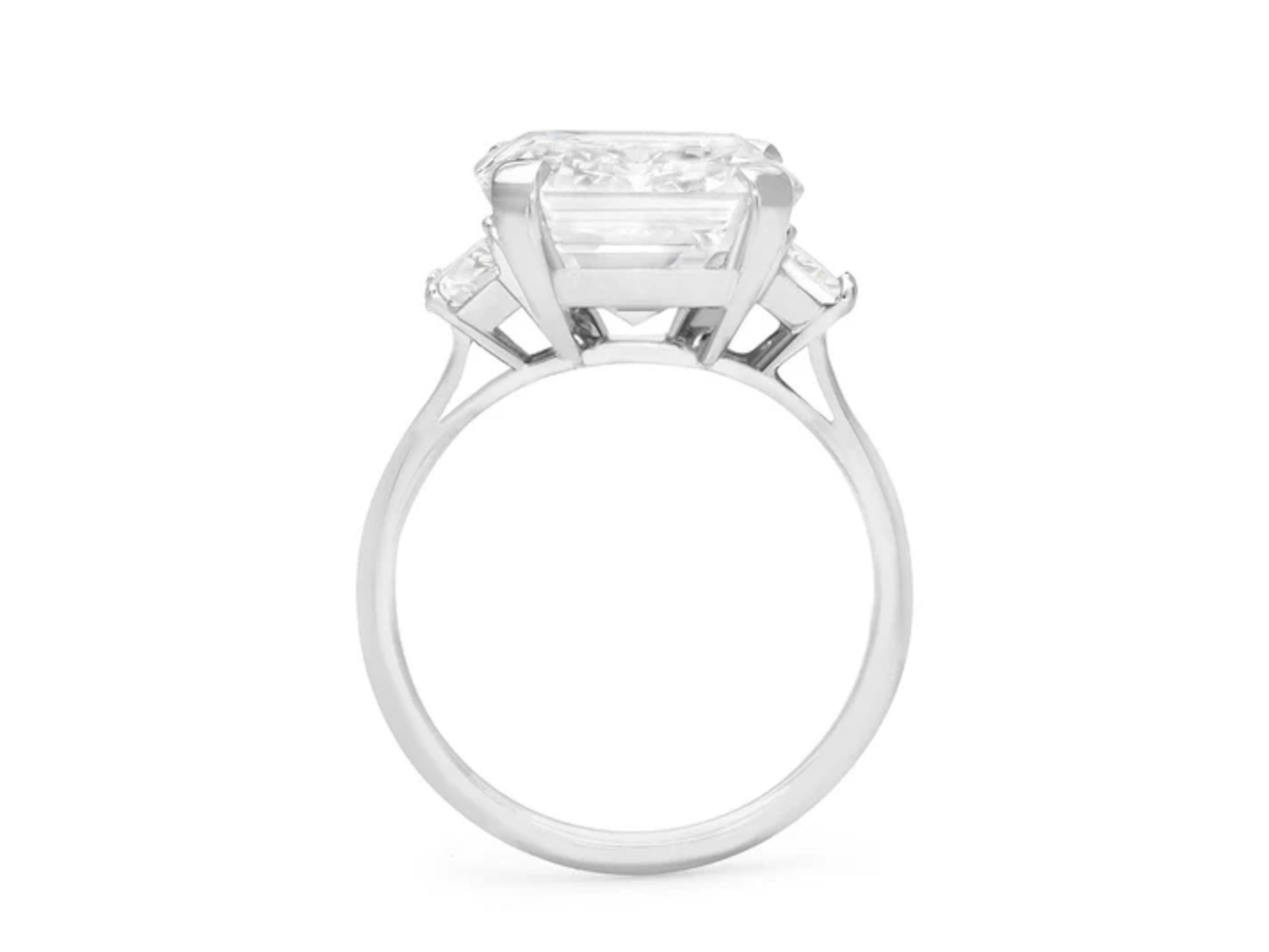 This exquisite ring by Cecile Blake is crafted in platinum and features a breathtaking 4 carat emerald cut diamond, certified by GIA flanked by two half moon diamonds at each side

Carat Weight:4 ct
Color Grade: G
Clarity Grade: VVS1

 The